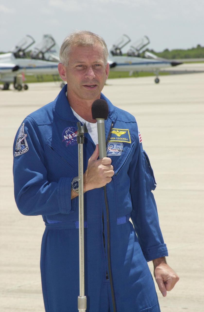 KENNEDY SPACE CENTER, FLA. - STS-111 Commander Kenneth Cockrell speaks to the media before leaving KSC along with his crew and Expedition 5. They have been taking part in Terminal Countdown Demonstration Test activities that include emergency egress training and a simulated launch countdown.  Mission STS-111 is known as Utilization Flight 2, carrying supplies and equipment in the Multi-Purpose Logistics Module Leonardo to the International Space Station.  The payload also includes the Mobile Base System, which will be installed on the Mobile Transporter to complete the Canadian Mobile Servicing System, or MSS, and a replacement wrist/roll joint for Canadarm 2. The mechanical arm will then have the capability to "inchworm" from the U.S. Lab Destiny to the MSS and travel along the truss to work sites. Expedition 5 will travel to the International Space Station on mission STS-111 as the replacement crew for Expedition 4, who will return to Earth aboard the orbiter. Launch is scheduled for May 30, 2002