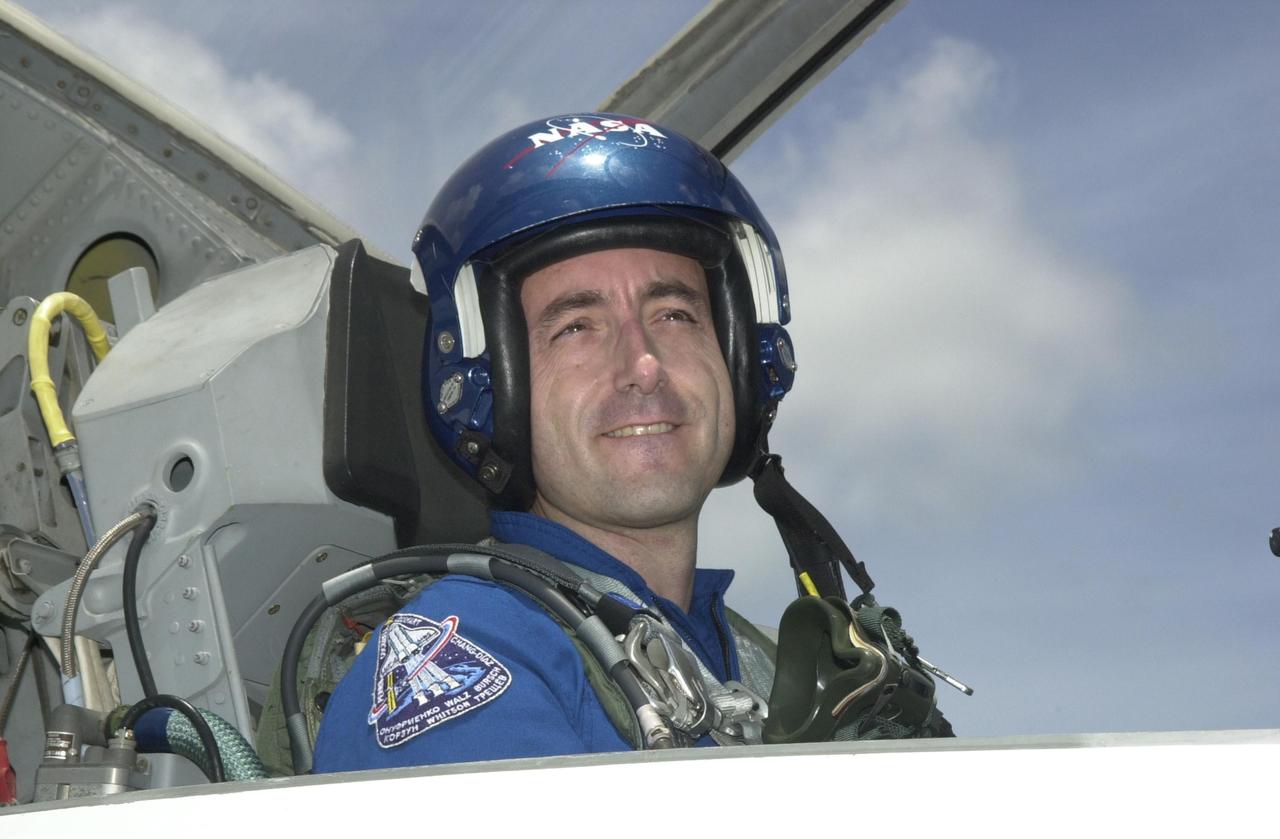 KENNEDY SPACE CENTER, FLA. - STS-111 Mission Specialist Philippe Perrin, with the French Space Agency, smiles on his arrival at KSC aboard a T-38 jet aircraft to prepare for launch. Mission STS-111, known as Utilization Flight 2, is carrying supplies and equipment to the International Space Station. The payload includes the Multi-Purpose Logistics Module Leonardo, the Mobile Base System, which will be installed on the Mobile Transporter to complete the Canadian Mobile Servicing System, or MSS, and a replacement wrist/roll joint for Canadarm 2. The mechanical arm will then have the capability to "inchworm" from the U.S. Lab Destiny to the MSS and travel along the truss to work sites. Also on board will be Expedition 5, traveling to the Station on Space Shuttle Endeavour as the replacement crew for Expedition 4, who will return to Earth aboard the orbiter. Launch is scheduled for May 30, 2002