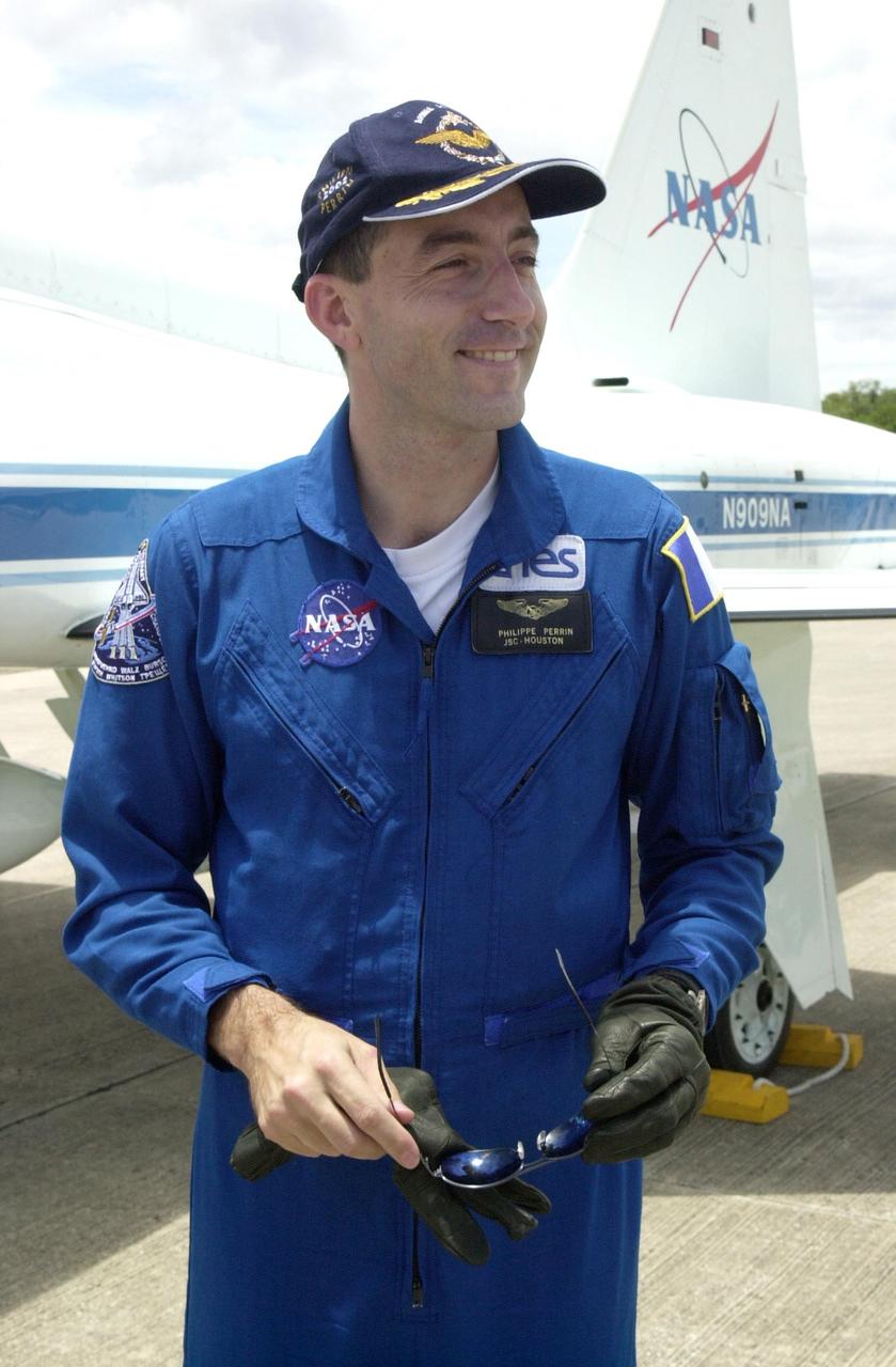 KENNEDY SPACE CENTER, FLA. - At the KSC Shuttle Landing Facility, STS-111 Mission Specialist Philippe Perrin, with the French Space Agency, waits for the rest of the crew before departing for Crew Quarters.  The crew has arrived to prepare for launch. Mission STS-111, known as Utilization Flight 2, is carrying supplies and equipment to the International Space Station. The payload includes the Multi-Purpose Logistics Module Leonardo, the Mobile Base System, which will be installed on the Mobile Transporter to complete the Canadian Mobile Servicing System, or MSS, and a replacement wrist/roll joint for Canadarm 2. The mechanical arm will then have the capability to "inchworm" from the U.S. Lab Destiny to the MSS and travel along the truss to work sites. Also on board will be Expedition 5, traveling to the Station on Space Shuttle Endeavour as the replacement crew for Expedition 4, who will return to Earth aboard the orbiter. Launch is scheduled for May 30, 2002