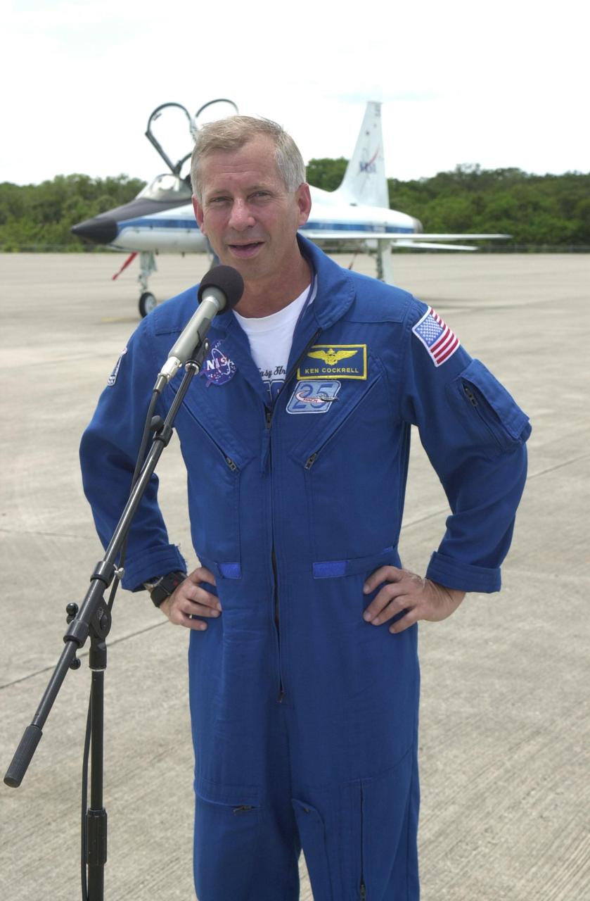KENNEDY SPACE CENTER, FLA. - After the STS-111 crew's arrival at KSC, Commander Kenneth Cockrell speaks to the media about the coming launch. Mission STS-111, known as Utilization Flight 2, is carrying supplies and equipment to the International Space Station. The payload includes the Multi-Purpose Logistics Module Leonardo, the Mobile Base System, which will be installed on the Mobile Transporter to complete the Canadian Mobile Servicing System, or MSS, and a replacement wrist/roll joint for Canadarm 2. The mechanical arm will then have the capability to "inchworm" from the U.S. Lab Destiny to the MSS and travel along the truss to work sites. Also on board will be Expedition 5, traveling to the Station on Space Shuttle Endeavour as the replacement crew for Expedition 4, who will return to Earth aboard the orbiter. Launch is scheduled for May 30, 2002