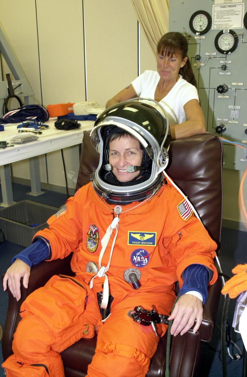 KENNEDY SPACE CENTER, FLA. -- Expedition 5 astronaut Peggy Whitson undergoes suit check as part of pre-launch activities. Part of Mission STS-111, Expedition 5 will travel to the International Space Station on Space Shuttle Endeavour as the replacement crew for Expedition 4, who will return to Earth aboard the orbiter. Known as Utilization Flight 2, Endeavour is carrying supplies and equipment to the Station. The payload includes the Multi-Purpose Logistics Module Leonardo, the Mobile Base System, which will be installed on the Mobile Transporter to complete the Canadian Mobile Servicing System, or MSS, and a replacement wrist/roll joint for Canadarm 2. The mechanical arm will then have the capability to "inchworm" from the U.S. Lab Destiny to the MSS and travel along the truss to work sites. Launch is scheduled for May 30, 2002