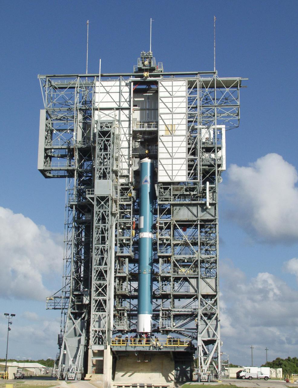 KENNEDY SPACE CENTER, FLA. -- On Launch Pad 17-A, Cape Canaveral Air Force Station, the Boeing Delta II rocket is lifted up the gantry. The rocket is the launch vehicle for the CONTOUR spacecraft, scheduled to launch July 1. CONTOUR will provide the first detailed look into the heart of a comet -- the nucleus. The spacecraft will fly close to at least two comets, Encke and Schwassmann-Wachmann 3, taking pictures of the nucleus while analyzing the gas and dust that surround these rocky, icy building blocks of the solar system.