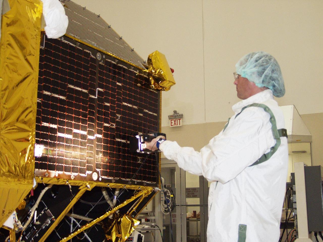 KENNEDY SPACE CENTER, FLA. -- In the Spacecraft Assembly and Encapsulation Facility 2, a lighting test is being conducted on the solar panels on the Comet Nucleus Tour (CONTOUR) spacecraft. The spacecraft will provide the first detailed look into the heart of a comet -- the nucleus. The spacecraft will fly as close as 60 miles (100 kilometers) to at least two comets and will take the sharpest pictures yet of the nucleus while analyzing the gas and dust that surround these rocky, icy building blocks of the solar system. Launch of CONTOUR aboard a Boeing Delta II rocket is scheduled for July 1 from Launch Pad 17-A, Cape Canaveral Air Force Station