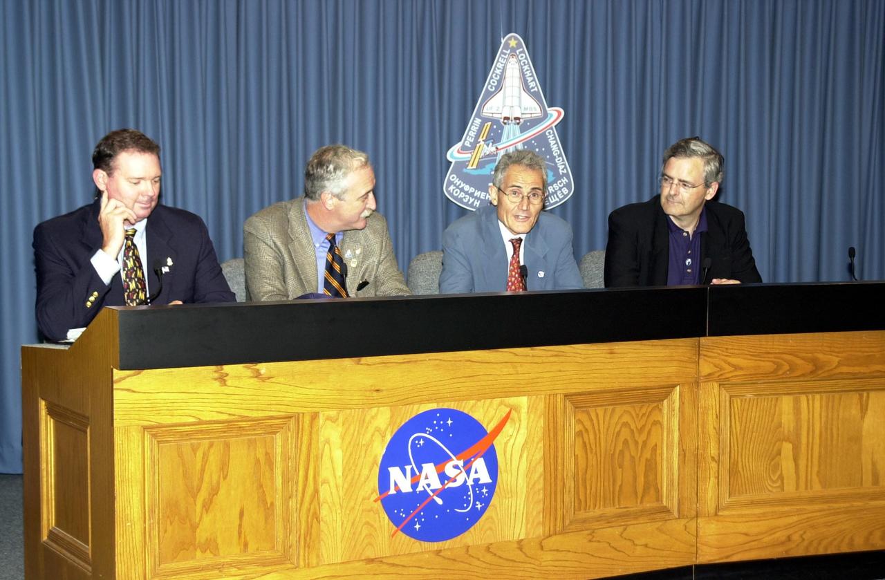 KENNEDY SPACE CENTER, FLA. -- In the Press Site auditorium, space agency officials participate in a media briefing following the launch scrub of Space Shuttle mission STS-111. From left are NASA/JSC Public Affairs Officer Kyle Herring, NASA Administrator Sean O'Keefe, French Space Agency President Dr. Alain Bensoussan, and Canadian Space Agency President Dr. Marc Garneau. STS-111 is the second Utilization Flight to the International Space Station, carrying the Multi-Purpose Logistics Module Leonardo, the Mobile Base System (MBS), and a replacement wrist/roll joint for the Canadarm 2. Also on board will be the Expedition Five crew who will replace Expedition Four on the Station. Launch is rescheduled for May 31 at 7:22 p.m. EDT