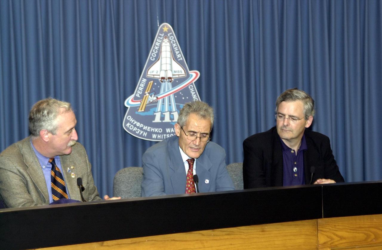 KENNEDY SPACE CENTER, FLA. -- In the Press Site auditorium, space agency officials participate in a media briefing following the launch scrub of Space Shuttle mission STS-111. From left are NASA Administrator Sean O'Keefe, French Space Agency President Dr. Alain Bensoussan, and Canadian Space Agency President Dr. Marc Garneau. STS-111 is the second Utilization Flight to the International Space Station, carrying the Multi-Purpose Logistics Module Leonardo, the Mobile Base System (MBS), and a replacement wrist/roll joint for the Canadarm 2. Also on board will be the Expedition Five crew who will replace Expedition Four on the Station. Launch is rescheduled for May 31 at 7:22 p.m. EDT
