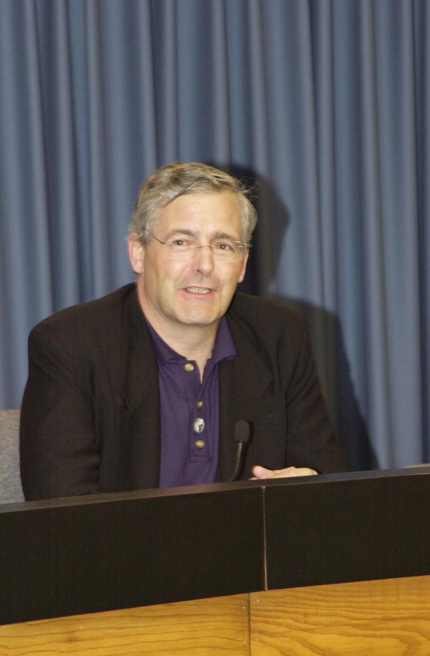 KENNEDY SPACE CENTER, FLA. -- In the Press Site auditorium, Canadian Space Agency President Dr. Marc Garneau participates in a media briefing following the launch scrub of Space Shuttle mission STS-111.  STS-111 is the second Utilization Flight to the International Space Station, carrying the Multi-Purpose Logistics Module Leonardo, the Mobile Base System (MBS), and a replacement wrist/roll joint for the Canadarm 2. Also on board will be the Expedition Five crew who will replace Expedition Four on the Station. Launch is rescheduled for May 31 at 7:22 p.m. EDT