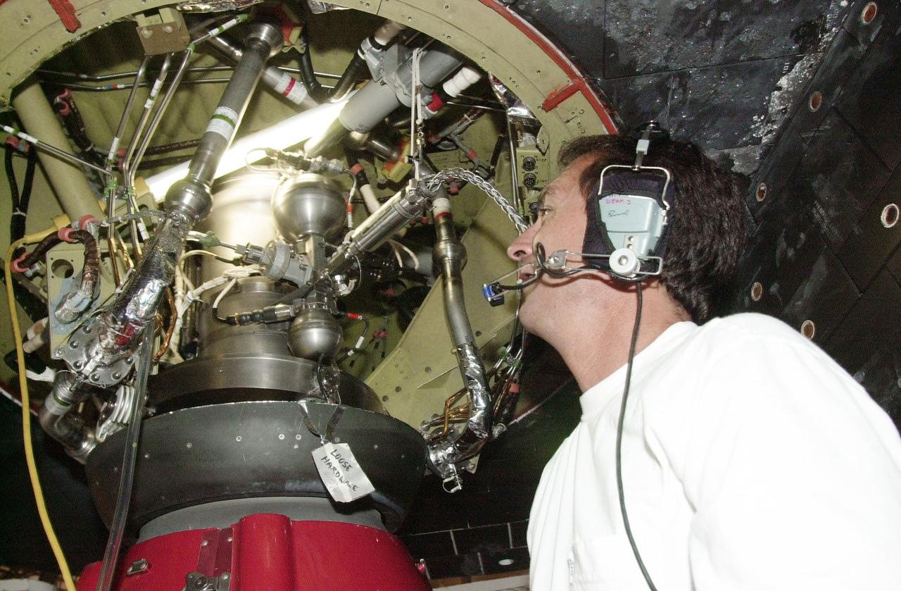 KENNEDY SPACE CENTER, FLA. -- United Space Alliance Aft Technician Bobby Wright looks at the gaseous nitrogen pressure regulator in the left Orbital Maneuvering System pod on Space Shuttle Endeavour. The component showed pressure differentials during the launch count May 30, 2002, and mission managers elected to replace it after the launch was scrubbed due to weather concerns. The launch of Endeavour on Mission STS-111, Utilization Flight 2 to the International Space Station, has been rescheduled for June 5, 2002