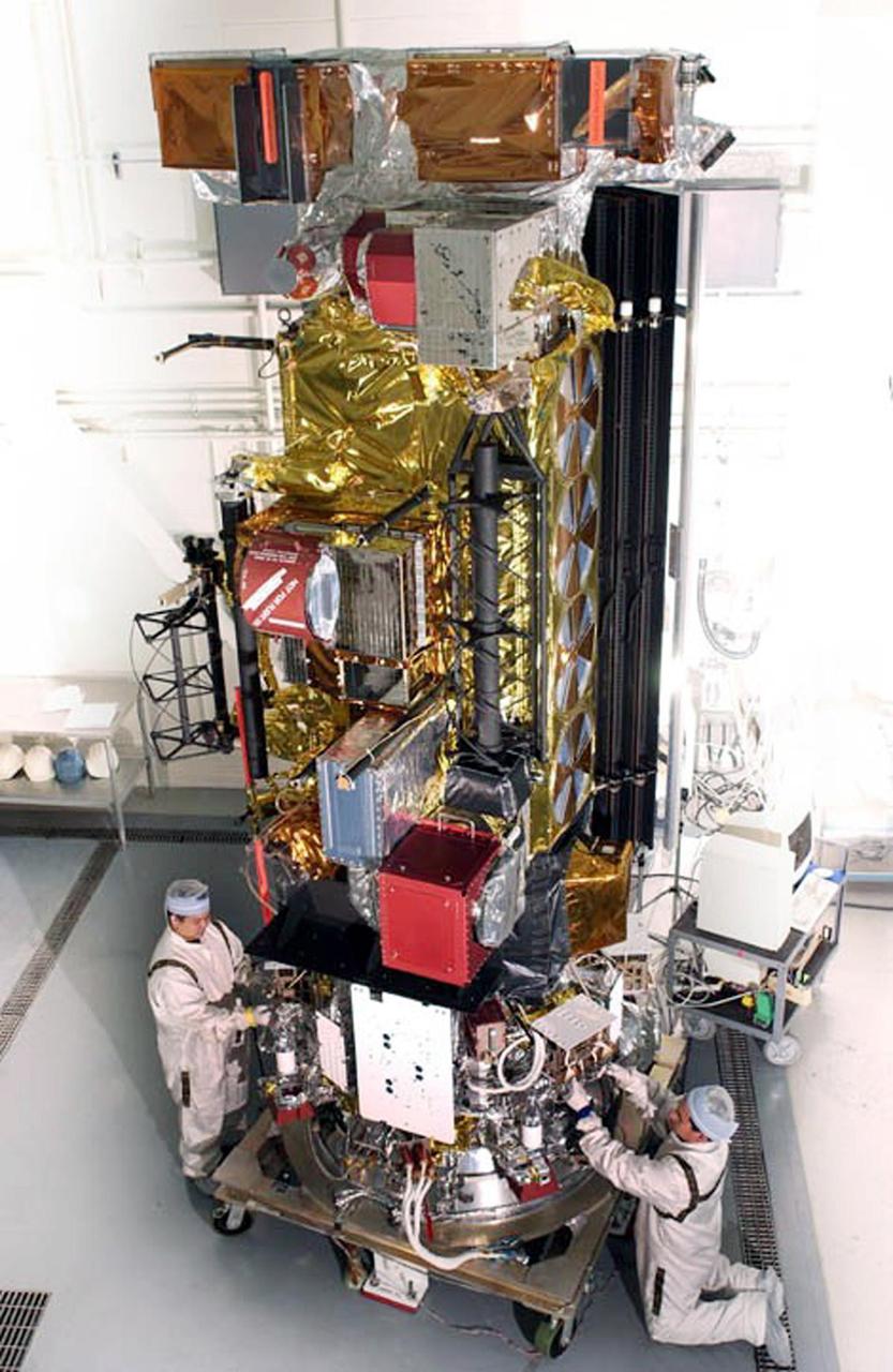 KENNEDY SPACE CENTER, FLA. --  Workers in checkout hangar 1610 on North Vandenberg Air Force Base complete final processing on the National Oceanic and Atmospheric Administration (NOAA-M)  spacecraft before transportation to Launch Complex 4W.   NOAA-M is another in a series of polar-orbiting Earth environmental observation satellites that provide global data to NOAA's short- and long-range weather forecasting systems.  Launch aboard a Titan II rocket is scheduled for June 25, 2002