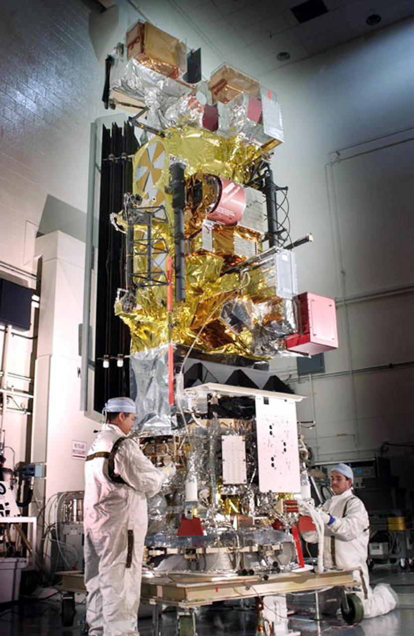 KENNEDY SPACE CENTER, FLA. -- Workers in checkout hangar 1610 on North Vandenberg Air Force Base complete final processing on the National Oceanic and Atmospheric Administration (NOAA-M)  spacecraft before transportation to Launch Complex 4W.   NOAA-M is another in a series of polar-orbiting Earth environmental observation satellites that provide global data to NOAA's short- and long-range weather forecasting systems.  Launch aboard a Titan II rocket is scheduled for June 25, 2002