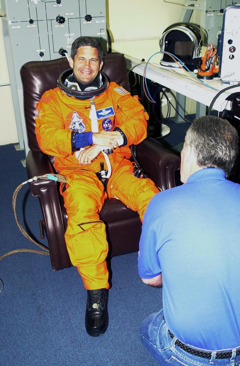 KENNEDY SPACE CENTER, FLA. -  STS-111 Pilot Paul Lockhart suits up again for the second launch attempt aboard Space Shuttle Endeavour on mission STS-111 to the International Space Station.  This is Lockhart's first Shuttle flight.  This mission marks the 14th Shuttle flight to the Space Station and the third Shuttle mission this year. Mission STS-111 is the 18th flight of Endeavour and the 110th flight overall in NASA's Space Shuttle program.  On mission STS-111, astronauts will deliver the Leonardo Multi-Purpose Logistics Module, the Mobile Base System (MBS), and the Expedition Five crew to the Space Station. During the seven days Endeavour will be docked to the Station, three spacewalks will be performed dedicated to installing MBS and the replacement wrist-roll joint on the Station's Canadarm2 robotic arm. Endeavour will also carry the Expedition 5 crew, who will replace Expedition 4 on board the Station. Expedition 4 crew members will return to Earth with the STS-111 crew. Liftoff is scheduled for 5:22 p.m. EDT from Launch Pad 39A