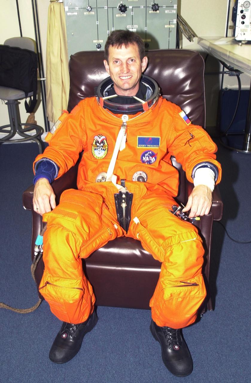 KENNEDY SPACE CENTER, FLA. - Expedition 5 cosmonaut Sergei Treschev suits up for the second launch attempt aboard Space Shuttle Endeavour on mission STS-111 to the International Space Station.  Expedition 5 will replace Expedition 4 on board the Station. Expedition 4 crew members will return to Earth with the STS-111 crew. This mission marks the 14th Shuttle flight to the International Space Station and the third Shuttle mission this year. Mission STS-111 is the 18th flight of Endeavour and the 110th flight overall in NASA's Space Shuttle program.  On mission STS-111, astronauts will deliver the Leonardo Multi-Purpose Logistics Module, the Mobile Base System (MBS), and the Expedition Five crew to the Space Station. During the seven days Endeavour will be docked to the Station, three spacewalks will be performed dedicated to installing MBS and the replacement wrist-roll joint on the Station's Canadarm2 robotic arm.  Liftoff is scheduled for 5:22 p.m. EDT from Launch Pad 39A