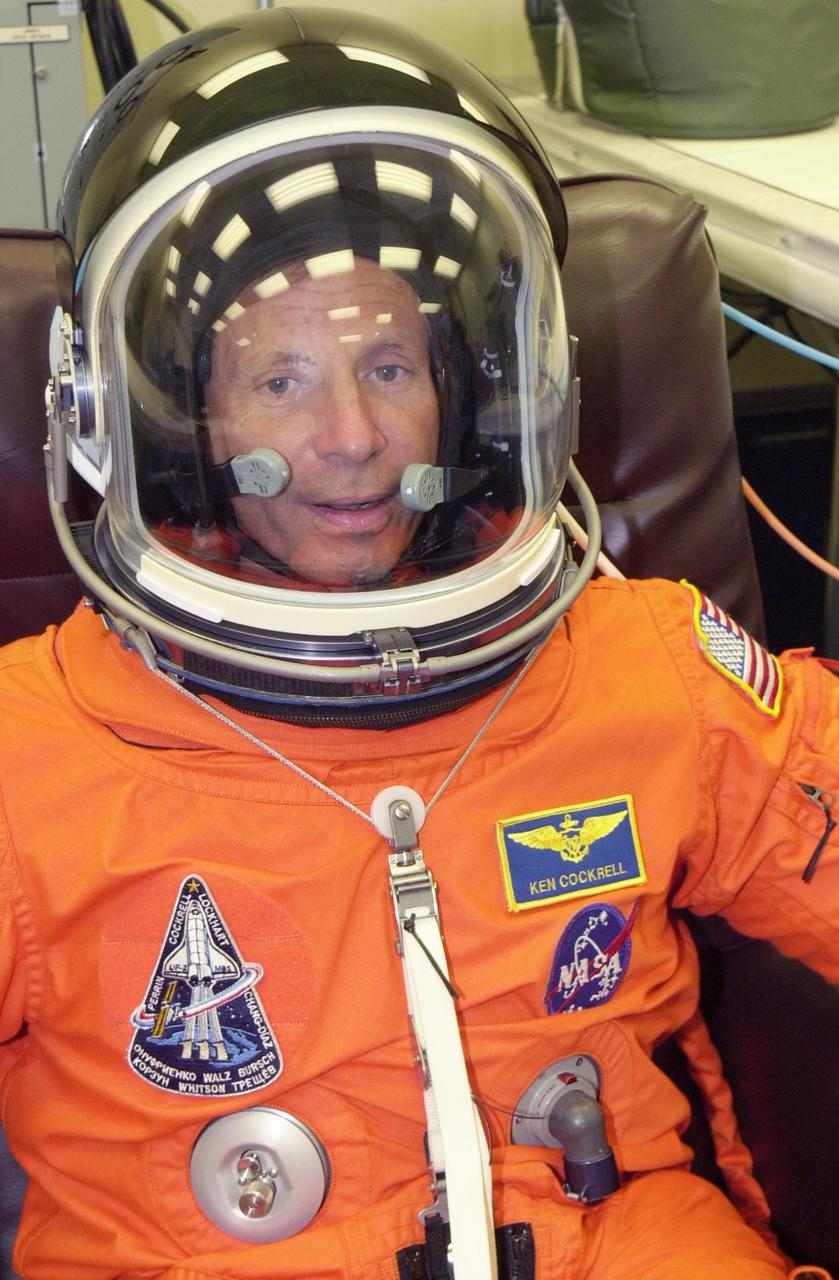 KENNEDY SPACE CENTER, FLA. - ST-111 Commander Kenneth Cockrell suits up again for the second launch attempt aboard Space Shuttle Endeavour on mission STS-111 to the International Space Station. This mission marks the 14th Shuttle flight to the Space Station and the third Shuttle mission this year. Mission STS-111 is the 18th flight of Endeavour and the 110th flight overall in NASA's Space Shuttle program.  On mission STS-111, astronauts will deliver the Leonardo Multi-Purpose Logistics Module, the Mobile Base System (MBS), and the Expedition Five crew to the Space Station. During the seven days Endeavour will be docked to the Station, three spacewalks will be performed dedicated to installing MBS and the replacement wrist-roll joint on the Station's Canadarm2 robotic arm. Endeavour will also carry the Expedition 5 crew, who will replace Expedition 4 on board the Station. Expedition 4 crew members will return to Earth with the STS-111 crew. Liftoff is scheduled for 5:22 p.m. EDT from Launch Pad 39A