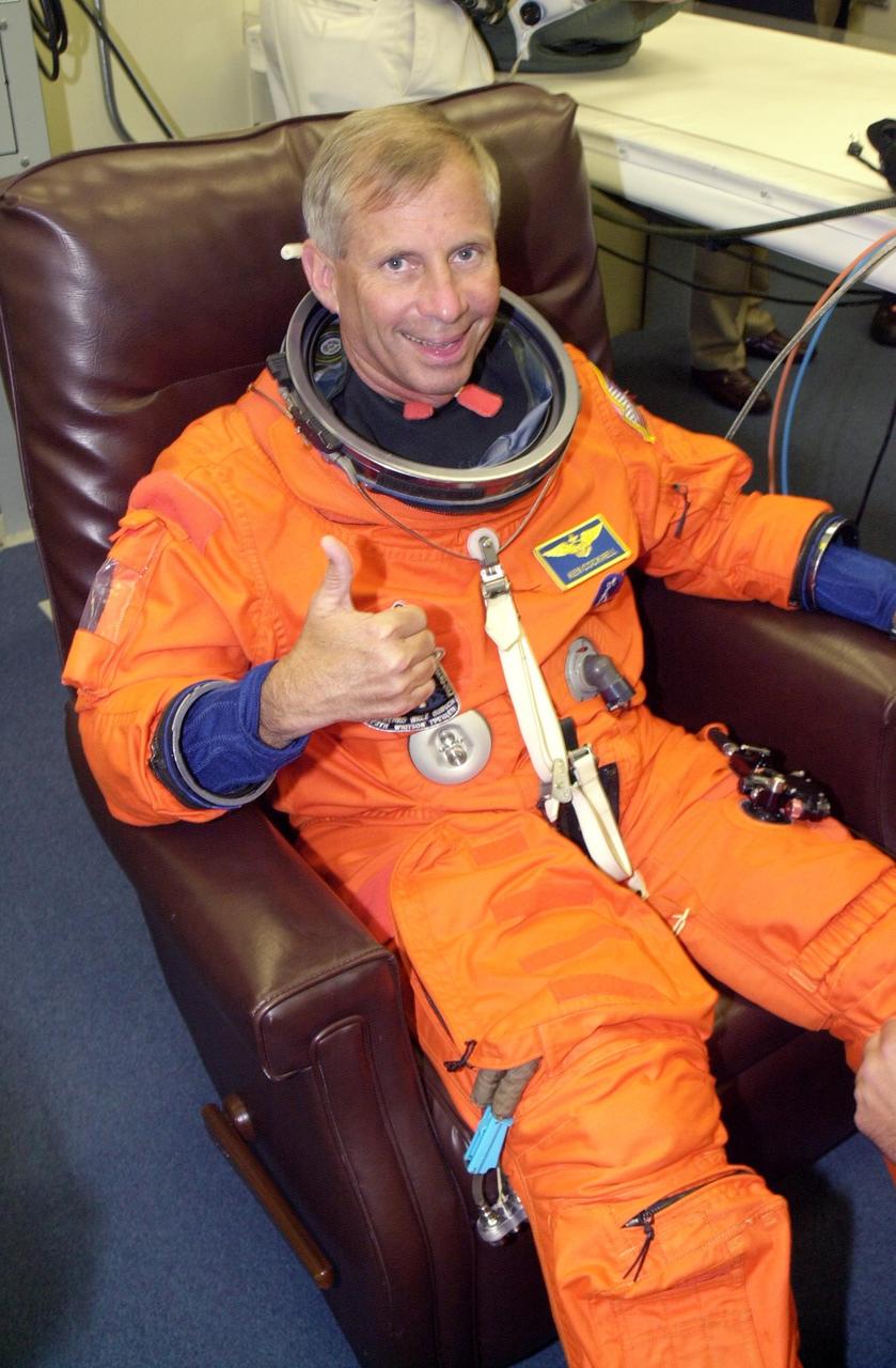 KENNEDY SPACE CENTER, FLA. - STS-111 Commander Kenneth Cockrell gives a thumbs up for a successful launch attempt, the second in six days, aboard Space Shuttle Endeavour on mission STS-111 to the International Space Station.  This is Cockrell's fifth Shuttle flight.  This mission marks the 14th Shuttle flight to the Space Station and the third Shuttle mission this year. Mission STS-111 is the 18th flight of Endeavour and the 110th flight overall in NASA's Space Shuttle program.  On mission STS-111, astronauts will deliver the Leonardo Multi-Purpose Logistics Module, the Mobile Base System (MBS), and the Expedition Five crew to the Space Station. During the seven days Endeavour will be docked to the Station, three spacewalks will be performed dedicated to installing MBS and the replacement wrist-roll joint on the Station's Canadarm2 robotic arm. Endeavour will also carry the Expedition 5 crew, who will replace Expedition 4 on board the Station. Expedition 4 crew members will return to Earth with the STS-111 crew. Liftoff is scheduled for 5:22 p.m. EDT from Launch Pad 39A