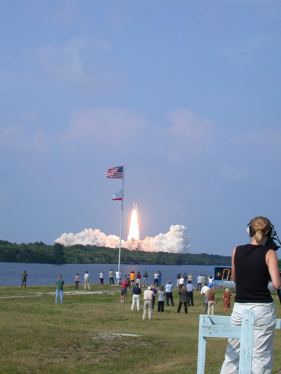 KENNEDY SPACE CENTER, FLA. -- Photographers gather near the turn basin in the Launch Complex 39 Area as Space Shuttle Endeavour roars into space on mission STS-111 to the International Space Station. Liftoff occurred at 5:22:49 p.m. EDT. The STS-111 crew includes Commander Kenneth Cockrell, Pilot Paul Lockhart, and Mission Specialists Franklin Chang-Diaz and Philippe Perrin (CNES), as well as the Expedition Five crew members Valeri Korzun, Peggy Whitson and Sergei Treschev. This mission marks the 14th Shuttle flight to the International Space Station and the third Shuttle mission this year. Mission STS-111 is the 18th flight of Endeavour and the 110th flight overall in NASA's Space Shuttle program. [Photo by Anita Barrett