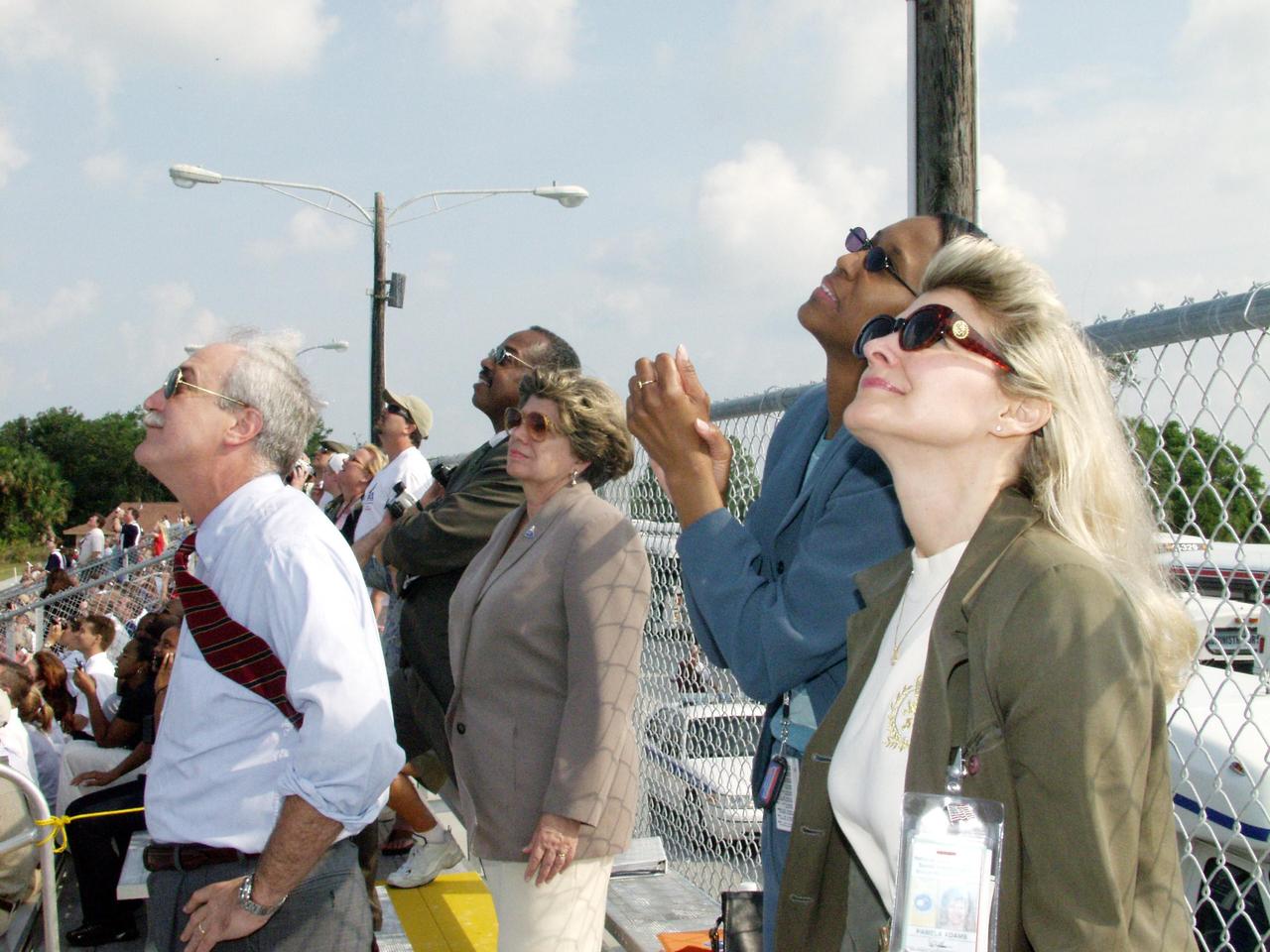 KENNEDY SPACE CENTER, FLA. -- NASA Administrator Sean O'Keefe (left), External Relations and Business Development Director JoAnn Morgan (center) and other guests watch the launch of Space Shuttle Endeavour on mission STS-111 to the International Space Station. Liftoff occurred on time at 5:22:49 p.m EDT. This mission marks the 14th Shuttle flight to the International Space Station and the third Shuttle mission this year. Mission STS-111 is the 18th flight of Endeavour and the 110th flight overall in NASA's Space Shuttle program