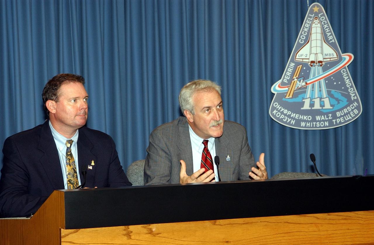 KENNEDY SPACE CENTER, FLA. --  Following the successful launch of Space Shuttle Endeavour on mission STS-111 today, NASA Administrator Sean O'Keefe (right) talks to the media in a briefing in the NASA/KSC television studio.  At left is Kyle Herring, public affairs office, Johnson Space Center, who moderated. 