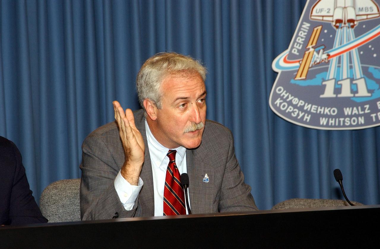 KENNEDY SPACE CENTER, FLA. -- Following the successful launch of Space Shuttle Endeavour on mission STS-111 today, NASA Administrator Sean O'Keefe (right) talks to the media in a briefing in the NASA/KSC television studio.