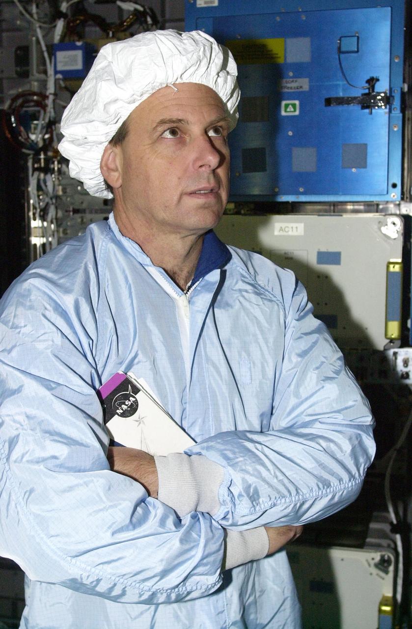 KENNEDY SPACE CENTER, FLA. - STS-107 Mission Specialist Ilan Ramon, with the Israeli Space Agency, looks at an experiment in the SHI Research Double Module (SHI/RDM), part of the payload on the mission. The crew is taking part in Crew Equipment Interface Test activities, which include equipment and payload familiarization. A research mission, STS-107 also will carry the Fast Reaction Experiments Enabling Science, Technology, Applications and Research (FREESTAR) that incorporates eight high priority secondary attached shuttle experiments. STS-107 is scheduled to launch July 19, 2002