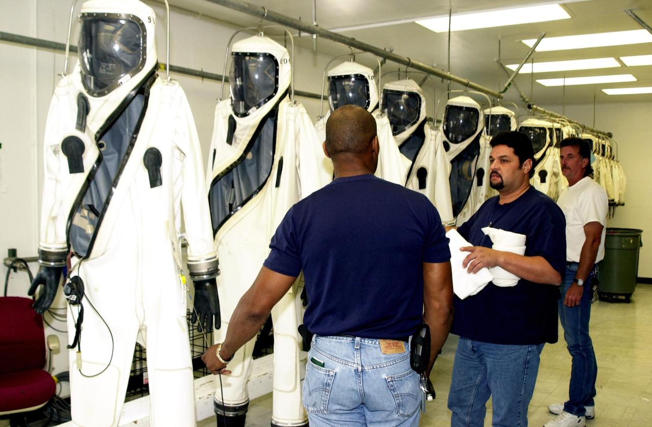 KENNEDY SPACE CENTER, FLA. - SCAPE suits are ready for worker who will use them during fueling of the Comet Nucleus Tour (CONTOUR) spacecraft in the Spacecraft Assembly and Encapsulation Facility 2 (SAEF-2).  SCAPE refers to Self-Contained Atmospheric Protective Ensemble.  CONTOUR will provide the first detailed look into the heart of a comet -- the nucleus. Flying as close as 60 miles (100 kilometers) to at least two comets, the spacecraft will take the sharpest pictures yet of a nucleus while analyzing the gas and dust that surround them.  CONTOUR is scheduled for launch aboard a Boeing Delta II rocket July 1, 2002, from Launch Complex 17-A, Cape Canaveral Air Force Station