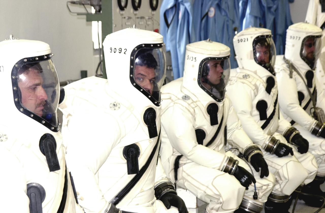 KENNEDY SPACE CENTER, FLA. -- Dressed in their SCAPE suits, workers are ready for the fueling of the Comet Nucleus Tour (CONTOUR) spacecraft in the Spacecraft Assembly and Encapsulation Facility 2 (SAEF-2). SCAPE refers to Self-Contained Atmospheric Protective Ensemble.  CONTOUR will provide the first detailed look into the heart of a comet -- the nucleus. Flying as close as 60 miles (100 kilometers) to at least two comets, the spacecraft will take the sharpest pictures yet of a nucleus while analyzing the gas and dust that surround them.  CONTOUR is scheduled for launch aboard a Boeing Delta II rocket July 1, 2002, from Launch Complex 17-A, Cape Canaveral Air Force Station