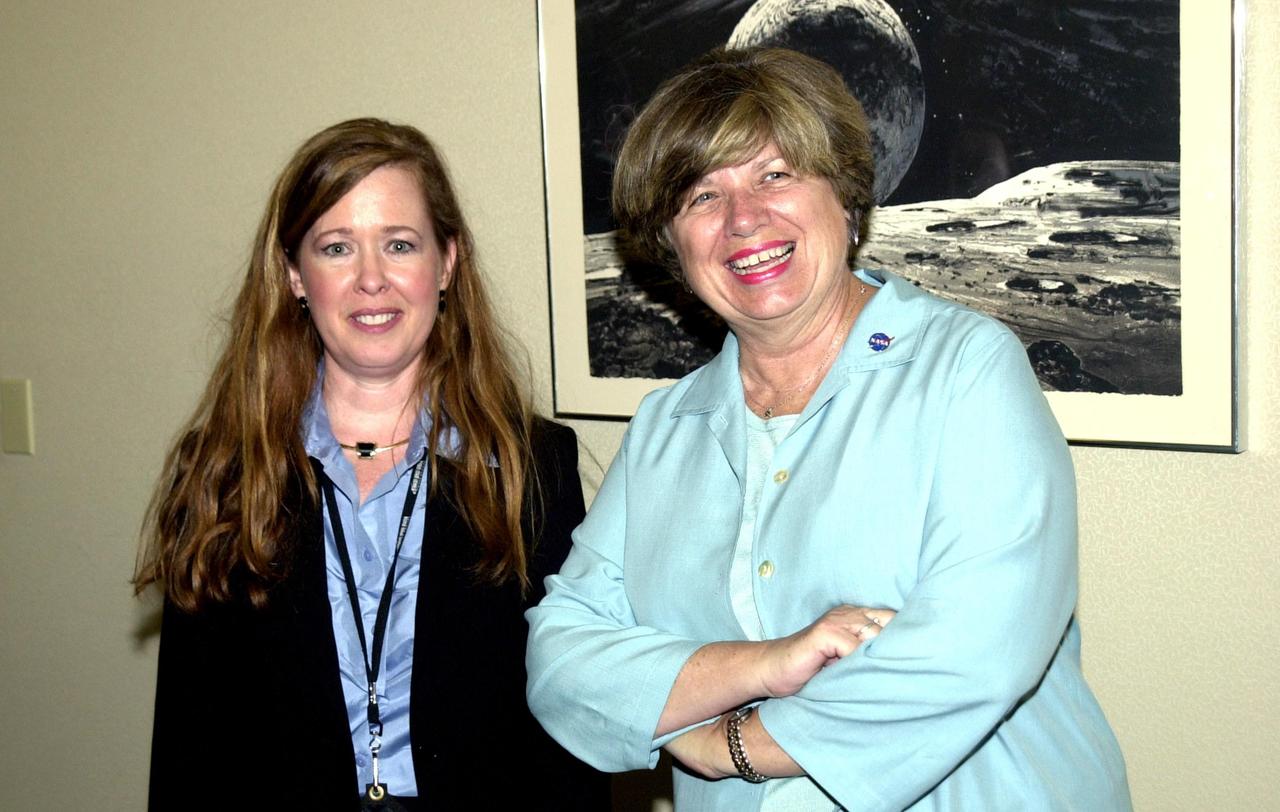 KENNEDY SPACE CENTER, FLA. --  External Relations and Business Development Division Chief Lisa Malone (left) and Director JoAnn Morgan take a break during the 2002 Florida Press Association and Florida Society of Newspaper Editors Convention held at the Debus Center, KSC Visitors Complex. Serving as keynote speaker for the event was NASA Associate Deputy Administrator Dr. Daniel Mulville.   Center Director Roy D. Bridges Jr. also addressed attendees and kicked off a tour of the Center