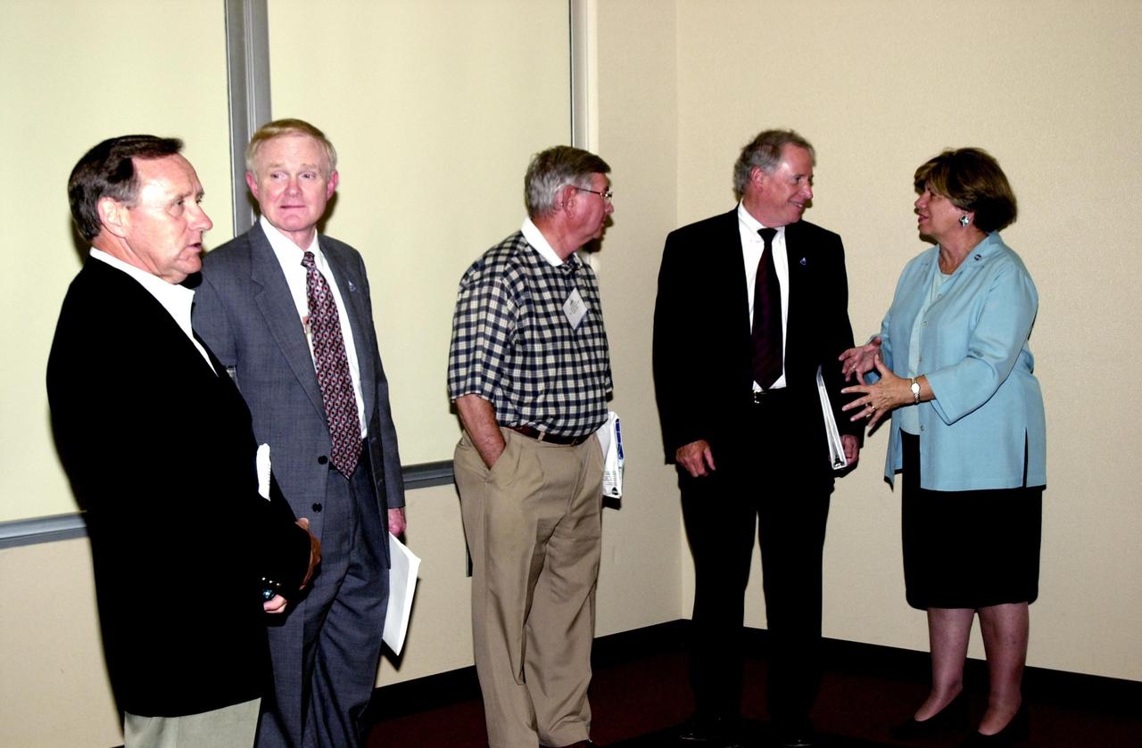 KENNEDY SPACE CENTER, FLA. -- During the 2002 Florida Press Association and Florida Society of Newspaper Editors Convention, held at the Debus Center, KSC Visitors Complex, key speakers gather.  From left are Michael Coleman, publisher, Florida Today; Roy D. Bridges Jr., Kennedy Space Center Director; Carl Cannon, publisher, Florida Times-Union and FPA president; Dr. Daniel R. Mulville, NASA associate deputy administrator; and JoAnn Morgan, director, KSC External Relations and Business Development.  Mulville was the keynote speaker. 