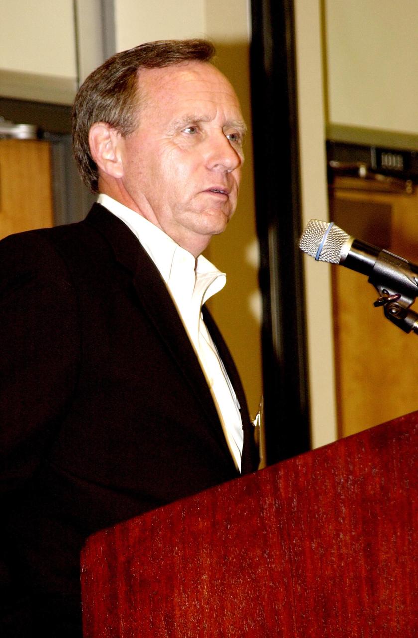 KENNEDY SPACE CENTER, FLA. -- Michael Coleman, publisher, Florida Today, addresses attendees of the 2002 Florida Press Association and Florida Society of Newspaper Editors Convention held at the Debus Center, KSC Visitors Complex.  Coleman hosted the convention. Serving as keynote speaker for the event was NASA Associate Deputy Administrator Dr. Daniel Mulville.   Center Director Roy D. Bridges Jr. also addressed attendees and kicked off a tour of the Center