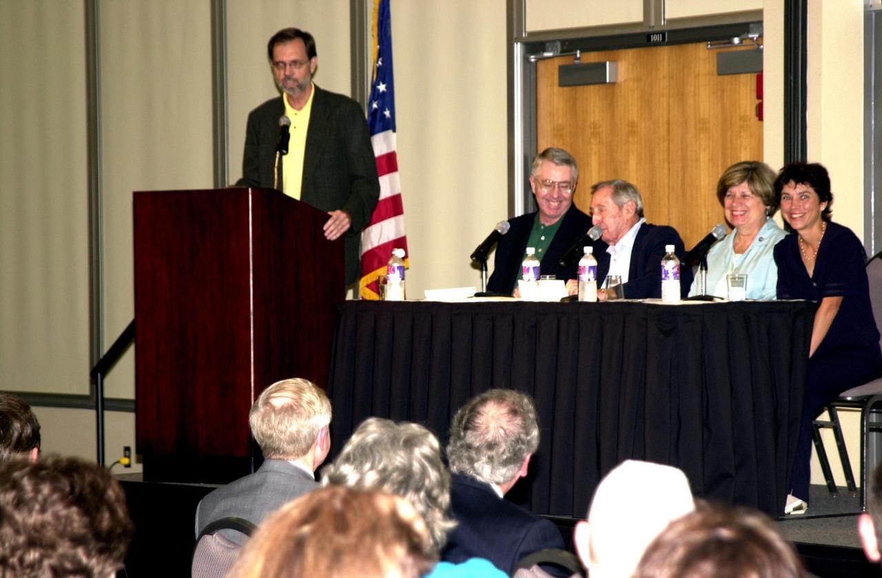 KENNEDY SPACE CENTER, FLA. -- The 2002 Florida Press Association and Florida Society of Newspaper Editors Convention offers a panel on space.  At the podium is Bob Stover, managing editor, Florida Today.  Seated on the panel are (left to right) Craig Covault, senior editor, Aviation Week; Howard Benedict, retired AP reporter; JoAnn Morgan, director, External Relations and Business Development, Kennedy Space Center; Marcia Dunn, AP reporter.  The convention was held at the Debus Center, KSC Visitors Complex.  Also speaking at the convention were Center Director Roy Bridges and NASA Associate Deputy Administrator Dr. Daniel Mulville