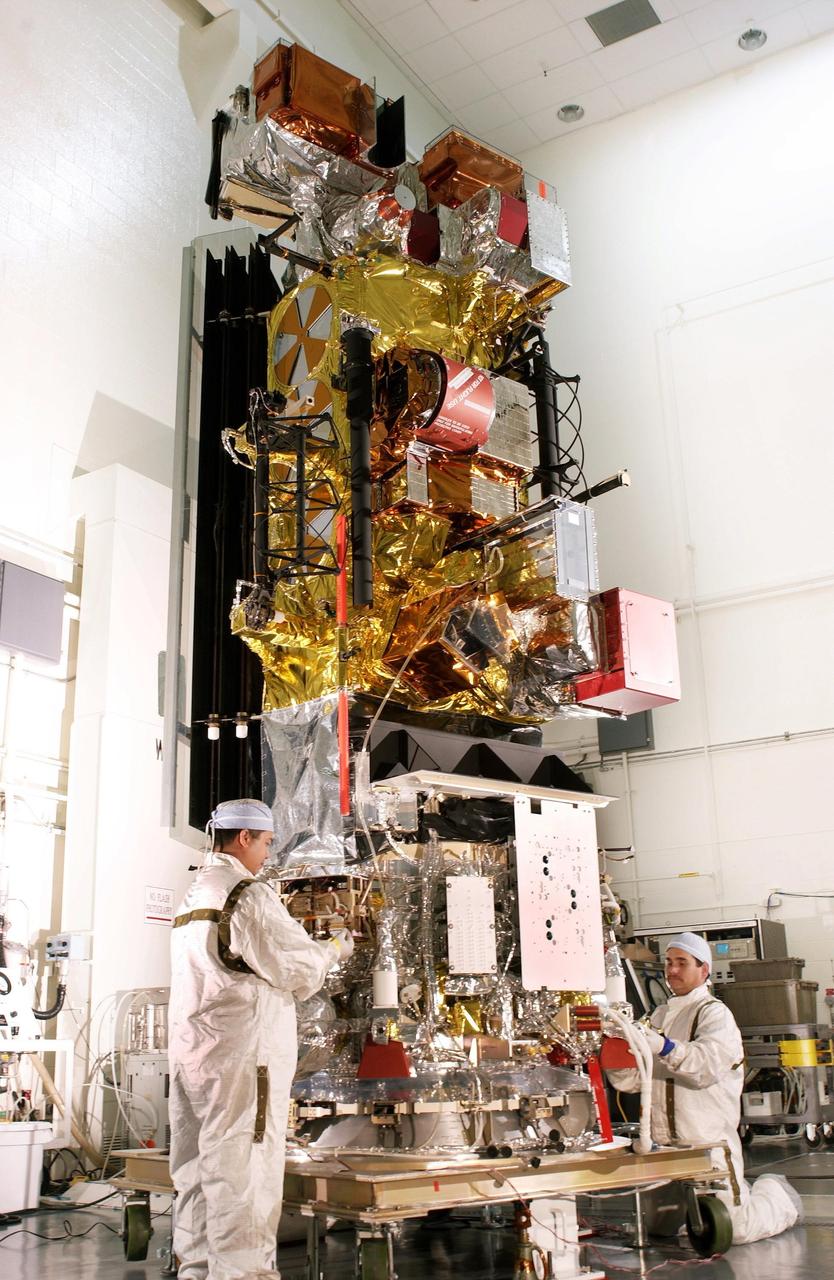 VANDENBERG AFB, CALIF. -- Workers at Vandenberg AFB, Calif., prepare the Lockheed Martin Missiles & Space National Oceanic and Atmospheric Administration's NOAA-M satellite forlaunch. NOAA-M is a polar-orbiting Earth environmental observation satellite that will provide global data to NOAA's short- and long-range weather forecasting systems. Launch of the NOAA-M aboard a Titan II rocket is scheduled for June 24, 2002, from VAFB