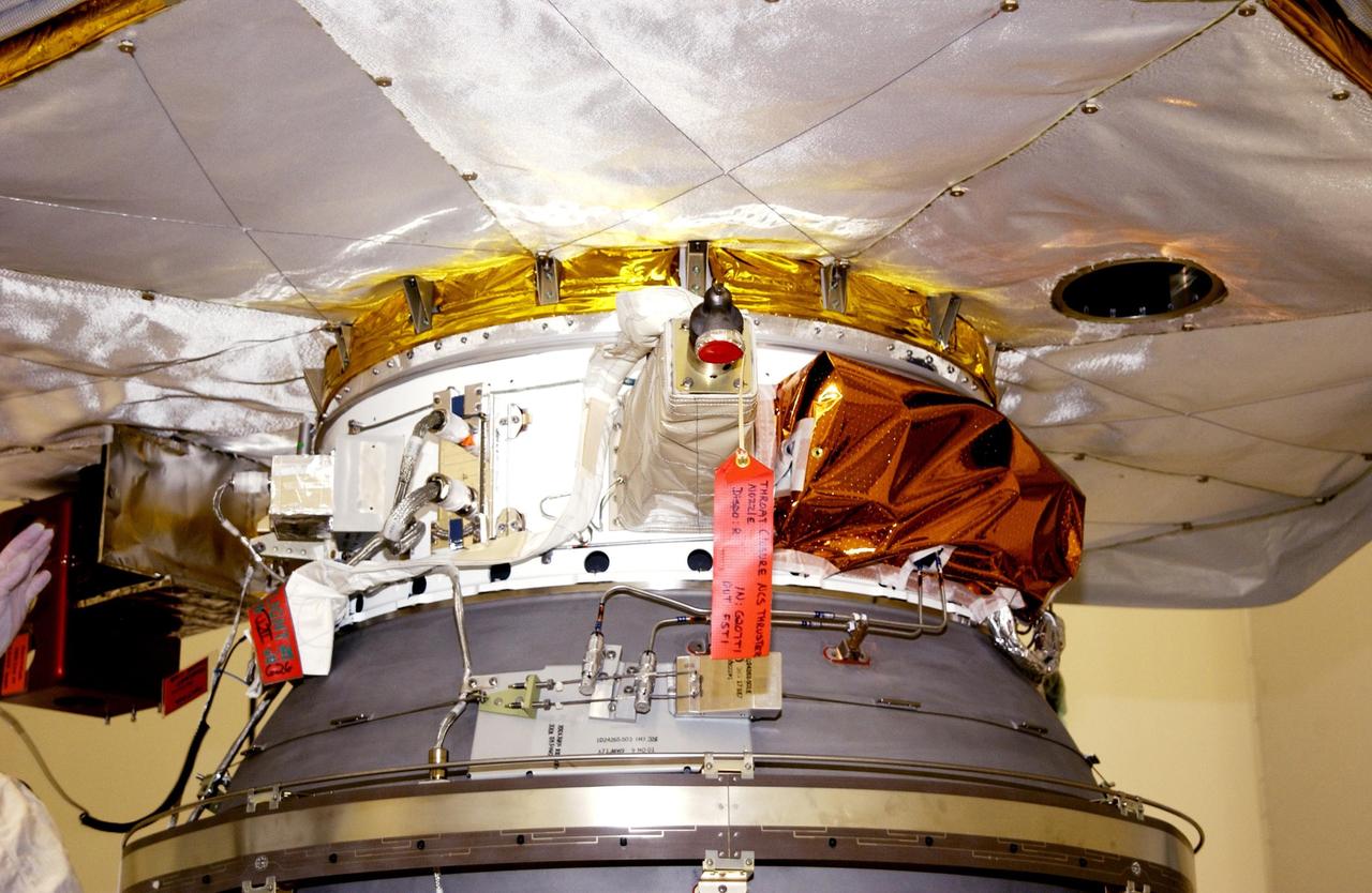 KENNEDY SPACE CENTER, FLA. -- The Comet Nucleus Tour (CONTOUR) spacecraft is mated to the upper stage of a Boeing Delta II rocket in the Space Assembly and Encapsulation Facility 2 (SAEF-2). CONTOUR will provide the first detailed look into the heart of a comet -- the nucleus. Flying as close as 60 miles (100 kilometers) to at least two comets, the spacecraft will take the sharpest pictures yet of a nucleus while analyzing the gas and dust that surround these rocky, icy building blocks of the solar system. Launch of CONTOUR aboard the Delta II is scheduled for July 1, 2002, from Launch Complex 17-A, Cape Canaveral Air Force Station