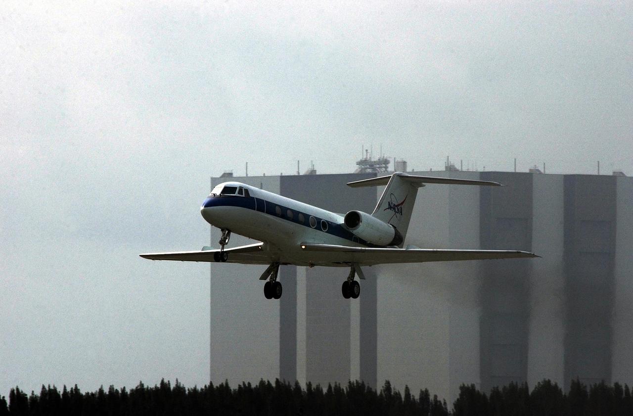 KENNEDY SPACE CENTER, FLA. -- A Shuttle Training Aircraft (STA) approaches the Shuttle Landing Facility after flying weather reconnaissance for the landing of Endeavour, returning from mission STS-111. Low cloud cover and other unfavorable weather conditions resulted in the wave off of two landing opportunities. The STA was flown by astronaut Kent Rominger