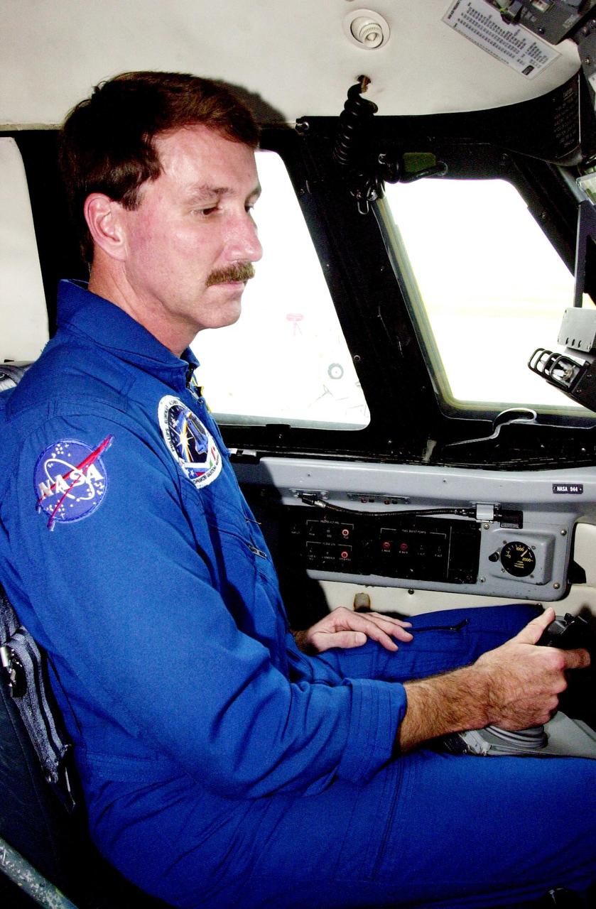 KENNEDY SPACE CENTER, FLA. - Astronaut Kent Rominger sits in the cockpit of a Shuttle Training Aircraft (STA) after flying weather reconnaissance for the landing of Endeavour, returning from mission STS-111. Low cloud cover and other unfavorable weather conditions resulted in the third day of wave off on two landing opportunities. Endeavour successfully landed at Edwards Air Force Base, Calif., completing 217 orbits and a 5.8-million-mile journey