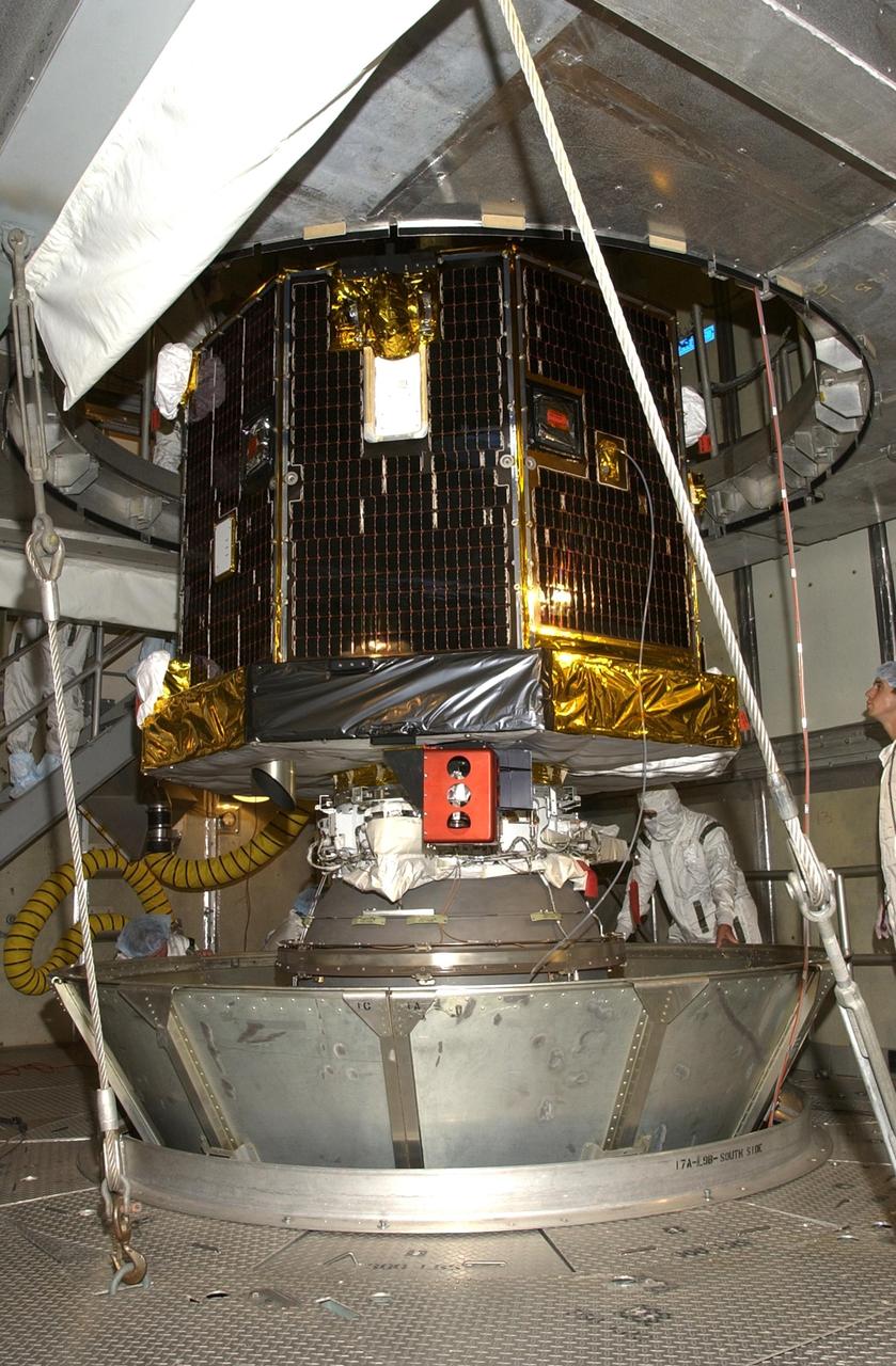 KENNEDY SPACE CENTER, FLA. -- On the tower at Launch Complex 17-A, Cape Canaveral Air Force Station, the Comet Nucleus Tour (CONTOUR) spacecraft waits for removal of the bottom of the canister. CONTOUR will provide the first detailed look into the heart of a comet -- the nucleus. Flying as close as 60 miles (100 kilometers) to at least two comets, the spacecraft will take the sharpest pictures yet of a nucleus while analyzing the gas and dust that surround these rocky, icy building blocks of the solar system. Launch of CONTOUR aboard a Boeing Delta II rocket is scheduled for July 1, 2002