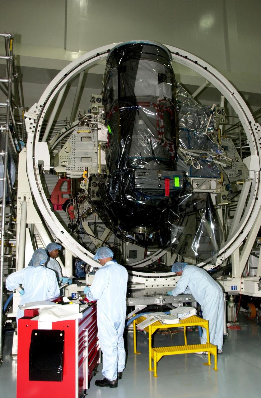 KENNEDY SPACE CENTER, FLA. -- During Crew Equipment Interface Test (CEIT), members of the STS-116 crew check out equipment they will be working with during their mission to the International Space Station. At left are Mission Specialist Christer Fugelsang, with the European Space Agency, Mission Specialist Robert Curbeam and Pilot William Oelefein.  The 19th assembly flight to the ISS, the mission will deliver the third port truss segment, the P5 Truss, to attach to second port truss segment, the P3/P4 Truss, to be assembled in an earlier mission.  STS-116 is scheduled for launch in June 2003.                        
