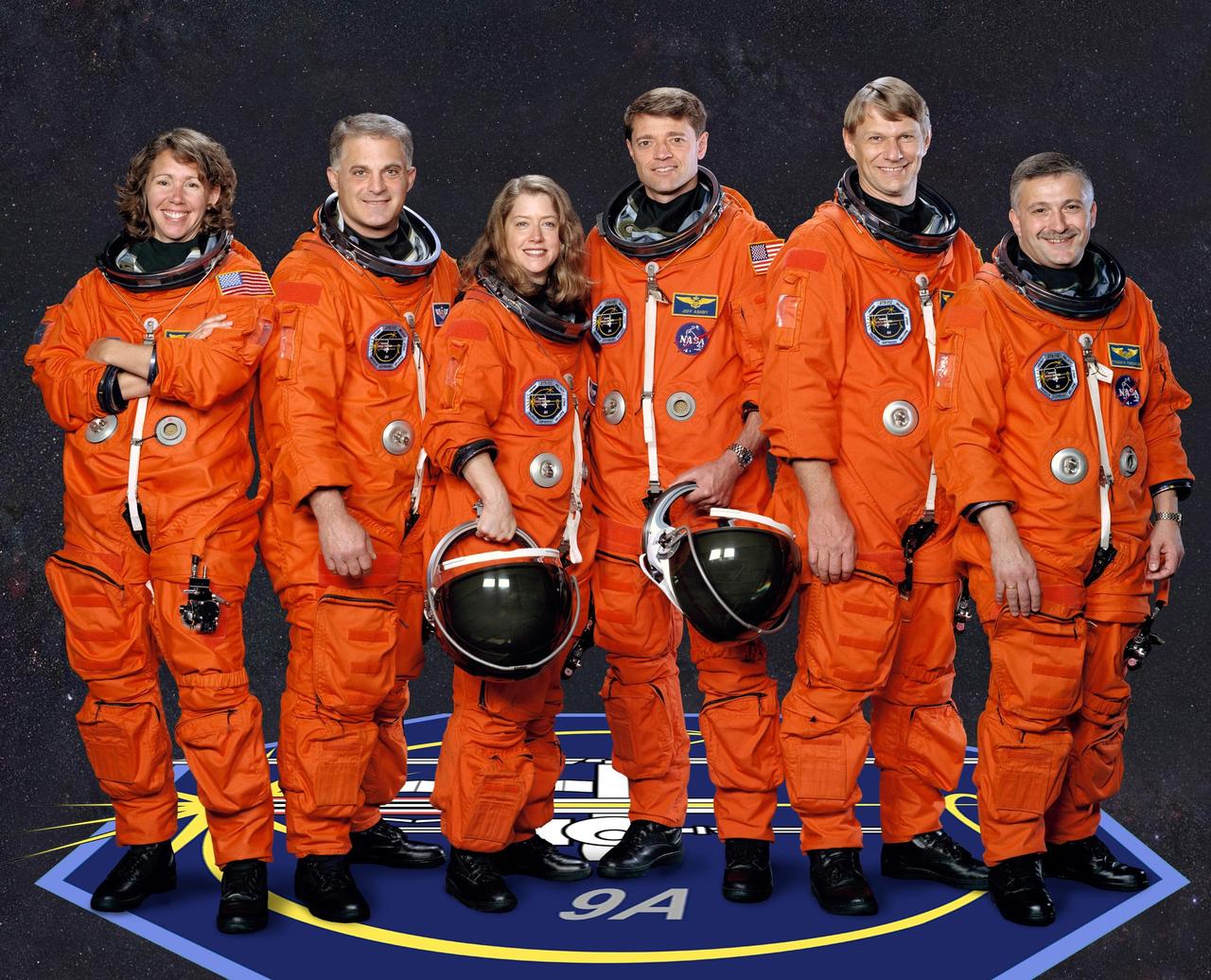 JOHNSON SPACE CENTER, HOUSTON, TEXAS -- (STS112-S-002) These five astronauts and cosmonaut take a break from training to pose for the STS-112 crew portrait.  Astronauts Pamela A. Melroy and Jeffrey S. Ashby, pilot and commander respectively, are in the center of the photo.  The mission specialists are from left to right, astronauts Sandra H. Magnus, David A. Wolf and Piers J. Sellers, and cosmonaut Fyodor Yurchikhin, who represents Rosaviakosmos.