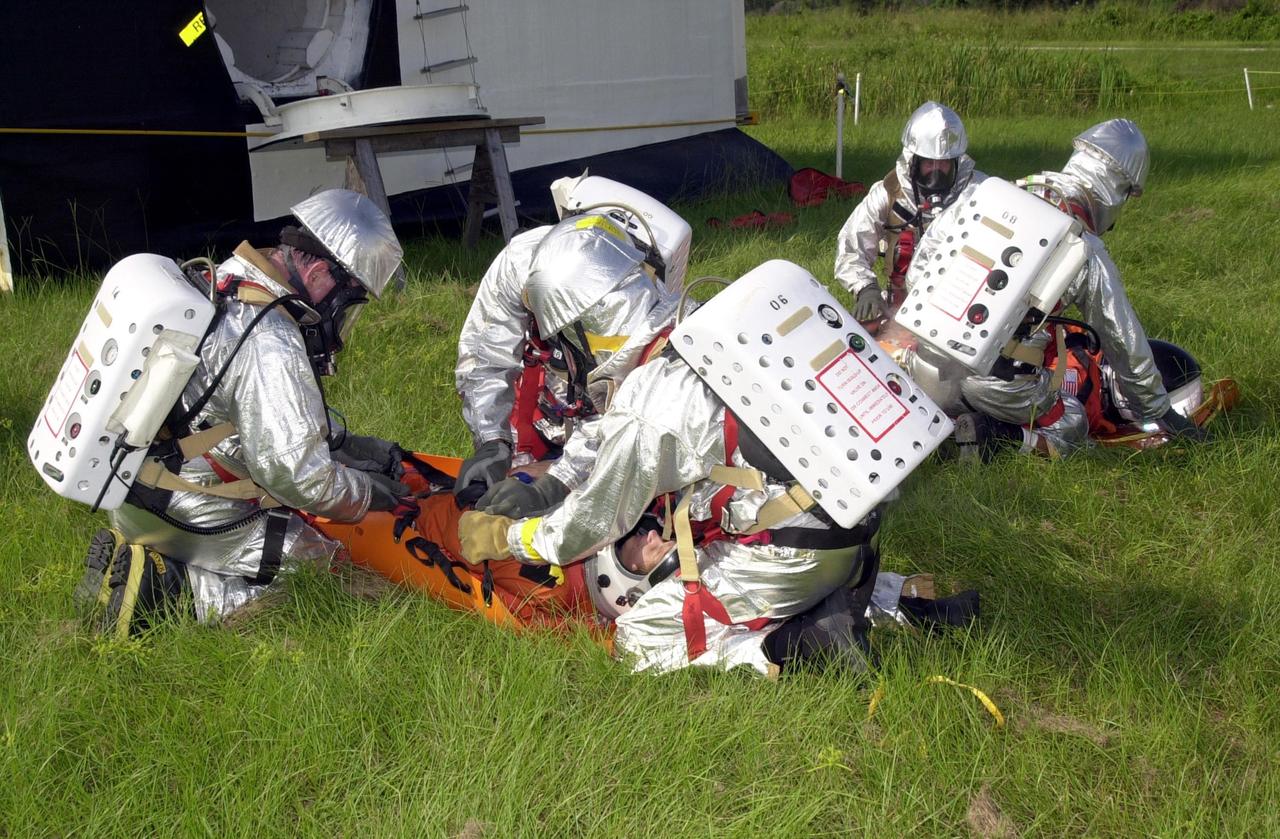 KENNEDY SPACE CENTER, FLA. - "Astronauts" were safely and successfully recovered from a "downed" Space Shuttle in a Mode VII contingency simulation led by Don Hammel, NASA Landing and Recovery Director. KSC Fire/Rescue and Emergency Medical workers, along with Johnson Space Center and Patrick Air Force Base personnel, participated in the drill. Mode simulations are held periodically at KSC to ensure contingency response forces are well prepared to respond to a wide variety of potential emergency situations.