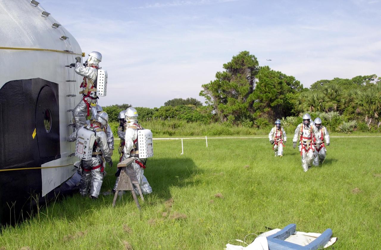 KENNEDY SPACE CENTER, FLA. - "Astronauts" were safely and successfully recovered from a "downed" Space Shuttle in a Mode VII contingency simulation led by Don Hammel, NASA Landing and Recovery Director. KSC Fire/Rescue and Emergency Medical workers, along with Johnson Space Center and Patrick Air Force Base personnel, participated in the drill. Mode simulations are held periodically at KSC to ensure contingency response forces are well prepared to respond to a wide variety of potential emergency situations.