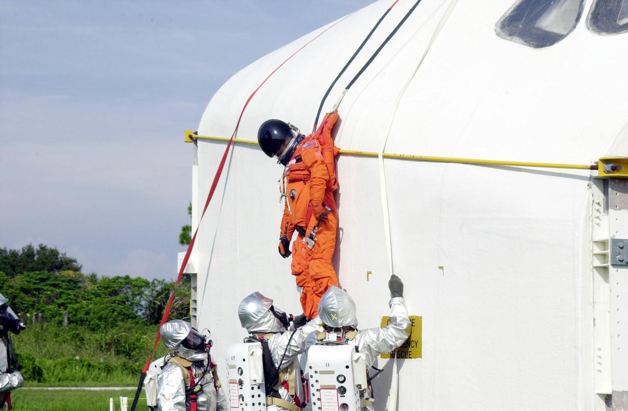 KENNEDY SPACE CENTER, FLA. - "Astronauts" were safely and successfully recovered from a "downed" Space Shuttle in a Mode VII contingency simulation led by Don Hammel, NASA Landing and Recovery Director. KSC Fire/Rescue and Emergency Medical workers, along with Johnson Space Center and Patrick Air Force Base personnel, participated in the drill. Mode simulations are held periodically at KSC to ensure contingency response forces are well prepared to respond to a wide variety of potential emergency situations.