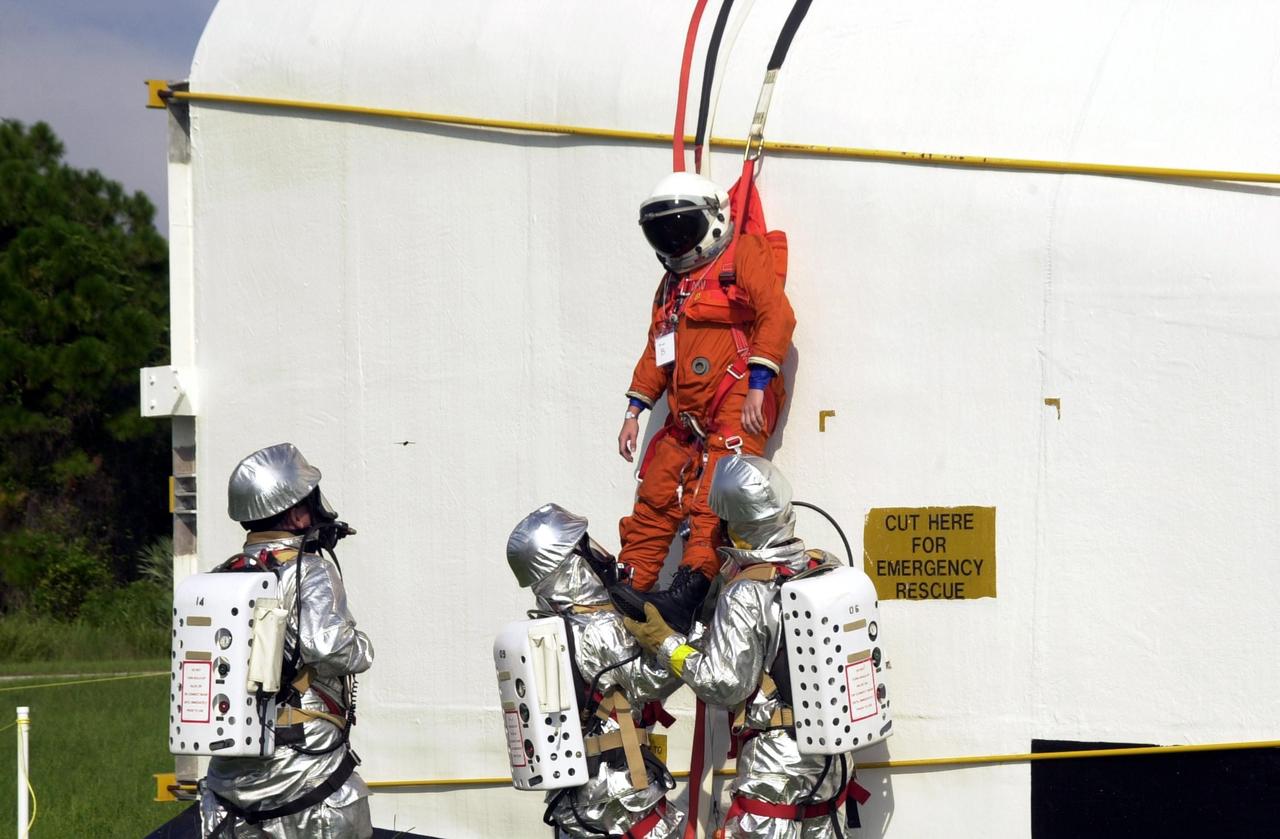 KENNEDY SPACE CENTER, FLA. - "Astronauts" were safely and successfully recovered from a "downed" Space Shuttle in a Mode VII contingency simulation led by Don Hammel, NASA Landing and Recovery Director. KSC Fire/Rescue and Emergency Medical workers, along with Johnson Space Center and Patrick Air Force Base personnel, participated in the drill. Mode simulations are held periodically at KSC to ensure contingency response forces are well prepared to respond to a wide variety of potential emergency situations.