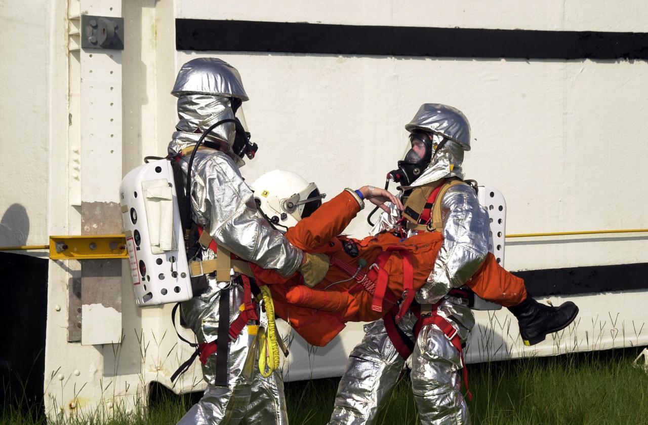 KENNEDY SPACE CENTER, FLA. - "Astronauts" were safely and successfully recovered from a "downed" Space Shuttle in a Mode VII contingency simulation led by Don Hammel, NASA Landing and Recovery Director. KSC Fire/Rescue and Emergency Medical workers, along with Johnson Space Center and Patrick Air Force Base personnel, participated in the drill. Mode simulations are held periodically at KSC to ensure contingency response forces are well prepared to respond to a wide variety of potential emergency situations.