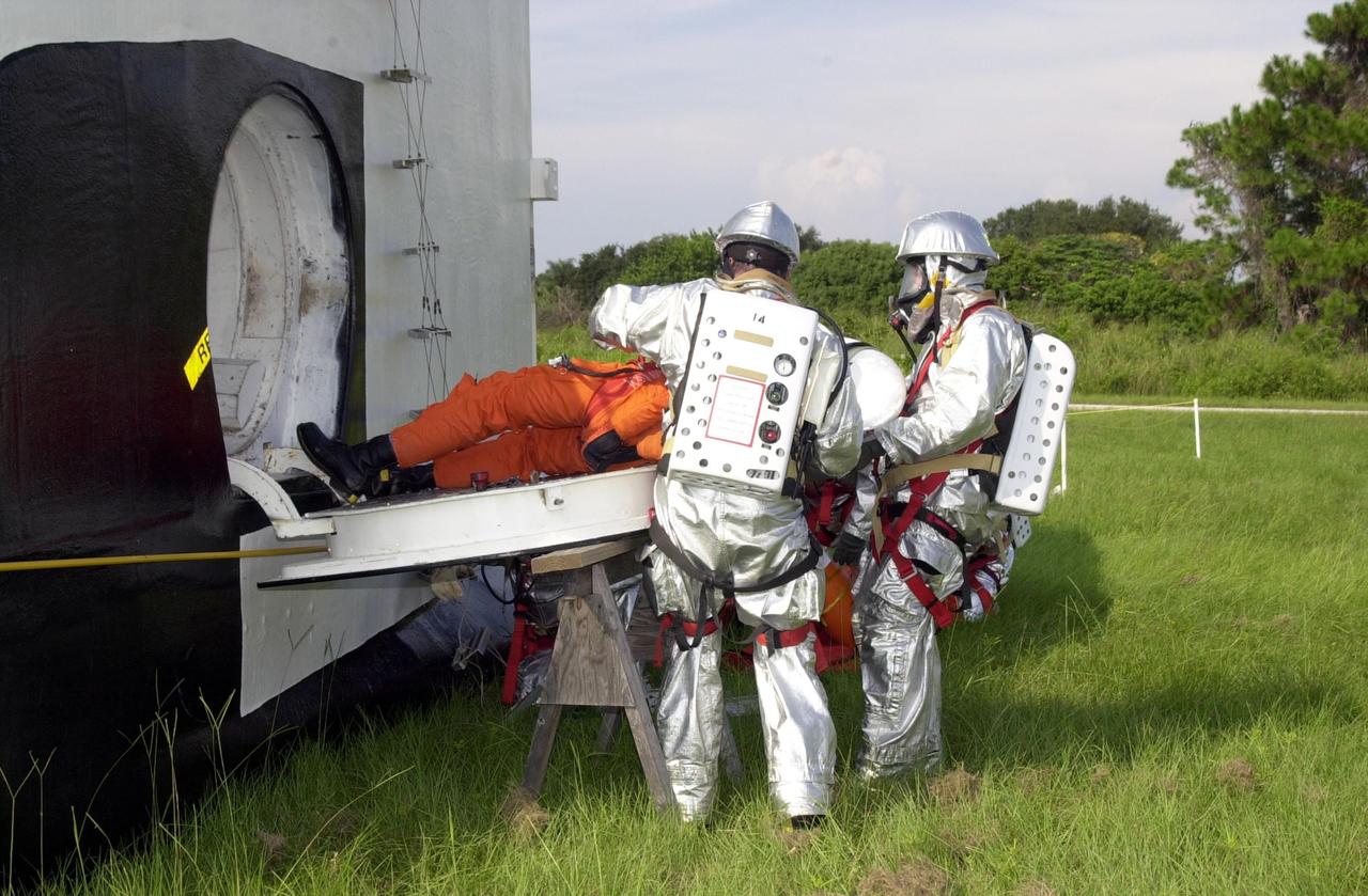 KENNEDY SPACE CENTER, FLA. - "Astronauts" were safely and successfully recovered from a "downed" Space Shuttle in a Mode VII contingency simulation led by Don Hammel, NASA Landing and Recovery Director. KSC Fire/Rescue and Emergency Medical workers, along with Johnson Space Center and Patrick Air Force Base personnel, participated in the drill. Mode simulations are held periodically at KSC to ensure contingency response forces are well prepared to respond to a wide variety of potential emergency situations.