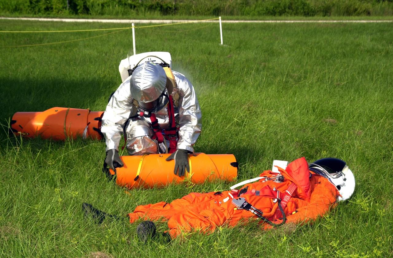 KENNEDY SPACE CENTER, FLA. - "Astronauts" were safely and successfully recovered from a "downed" Space Shuttle in a Mode VII contingency simulation led by Don Hammel, NASA Landing and Recovery Director. KSC Fire/Rescue and Emergency Medical workers, along with Johnson Space Center and Patrick Air Force Base personnel, participated in the drill. Mode simulations are held periodically at KSC to ensure contingency response forces are well prepared to respond to a wide variety of potential emergency situations.