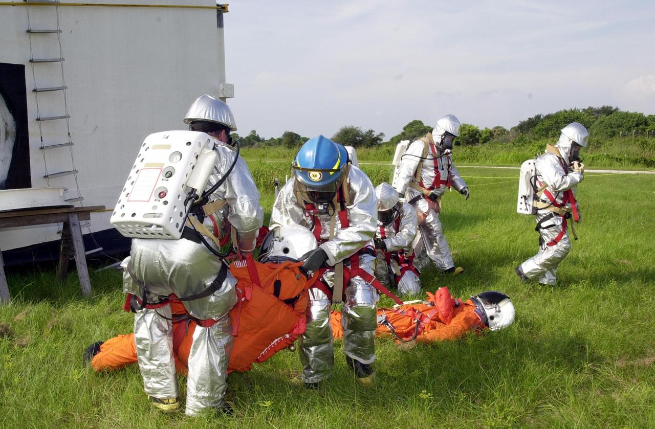 KENNEDY SPACE CENTER, FLA. - "Astronauts" were safely and successfully recovered from a "downed" Space Shuttle in a Mode VII contingency simulation led by Don Hammel, NASA Landing and Recovery Director. KSC Fire/Rescue and Emergency Medical workers, along with Johnson Space Center and Patrick Air Force Base personnel, participated in the drill. Mode simulations are held periodically at KSC to ensure contingency response forces are well prepared to respond to a wide variety of potential emergency situations.