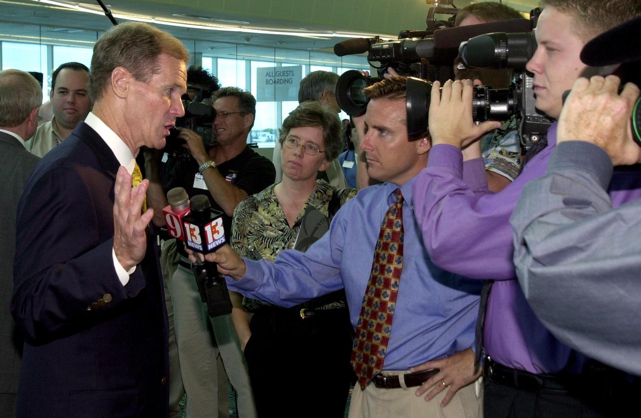 KENNEDY SPACE CENTER, FLA. - U.S. Sen. Bill Nelson talks to the media after the master plan signing ceremony at Port Canaveral Terminal 10.  Also attending were Canaveral National Seashore Superintendent Robert Newkirk, Canaveral Port Authority Executive Director Malcolm "Mac" McLouth, KSC Director Roy Bridges Jr., U.S. Rep. Dave Weldon, 45th Space Wing Commander Gregory Pavlovich, U.S. Fish & Wildlife Services Refuge Manager Ron Hight, Naval Ordnance Test Unit Commanding Officer William Borger, and Florida Space Authority Executive Director Ed Gormel. The plan represents interagency cooperation between the leadership group's  agencies and the U.S. Fish and Wildlife Service, the National Park Service and U.S. Navy.  Joining them in developing a vision of the Spaceport's future have been aerospace educators, researchers, and businesses, along with representatives from local, state and national government.  