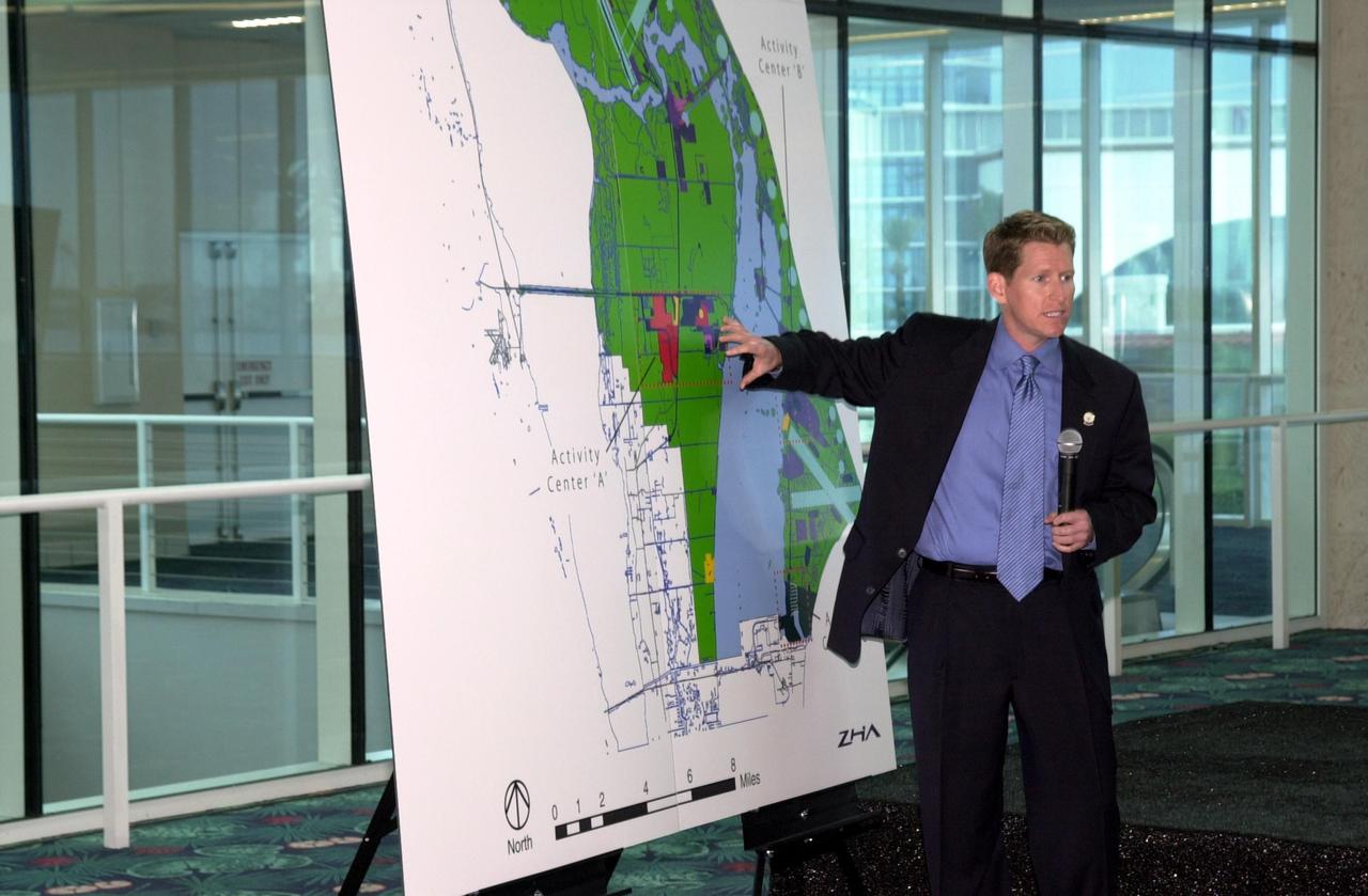 KENNEDY SPACE CENTER, FLA. -  During the master plan signing ceremony at Port Canaveral Terminal 10, Matt Taylor gives a presentation to attendees, who included Canaveral National Seashore Superintendent Robert Newkirk, Canaveral Port Authority Executive Director Malcolm "Mac" McLouth, KSC Director Roy Bridges Jr., U.S. Rep. Dave Weldon, 45th Space Wing Commander Gregory Pavlovich, U.S. Fish & Wildlife Services Refuge Manager Ron Hight, Naval Ordnance Test Unit Commanding Officer William Borger, and Florida Space Authority Executive Director Ed Gormel.  Taylor is vice president and chief planning officer of ZHA, Inc., which provided consulting services for the plan.  The plan represents interagency cooperation between the leadership group's  agencies and the U.S. Fish and Wildlife Service, the National Park Service and U.S. Navy.  Joining them in developing a vision of the Spaceport's future have been aerospace educators, researchers, and businesses, along with representatives from local, state and national government.