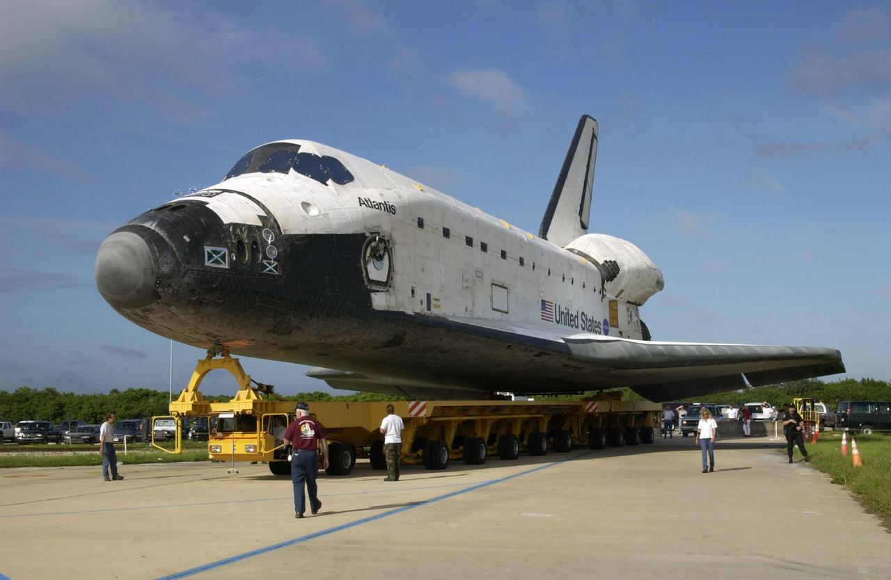KENNEDY SPACE CENTER, FLA. -- Orbiter Atlantis begins turning after leaving the Orbiter Processing Facility to begin the next stage of preparation for launch. Atlantis will be making its 26th flight on mission STS-112, an assembly flight to the International Space Station. The orbiter will carry the first starboard truss segment, S1, which will be attached to the Central truss segment, the S0 Truss, on the Station. Atlantis is scheduled to launch no earlier than Oct. 2.