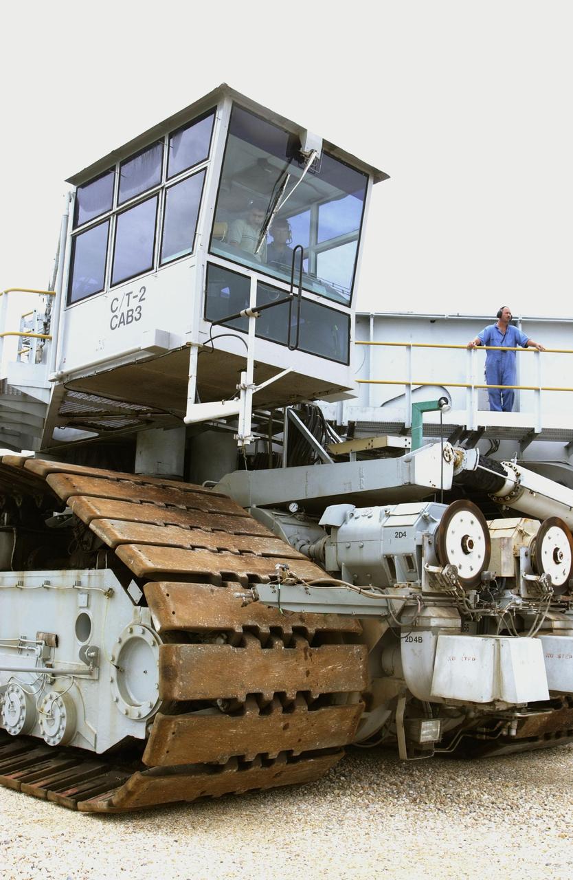 KENNEDY SPACE CENTER, FLA. -- After technicians removed and replaced all of the 32 bearings located in the JEL (jacking, equalization and leveling) cylinders and reinstalled the 16 cylinders on Crawler Transporter No. 2, workers take the crawler for a test run. During routine inspections, technicians found cracks in some of the bearings in the 16 JEL cylinders on the vehicle. There are 16 cylinders and 32 bearings per crawler.