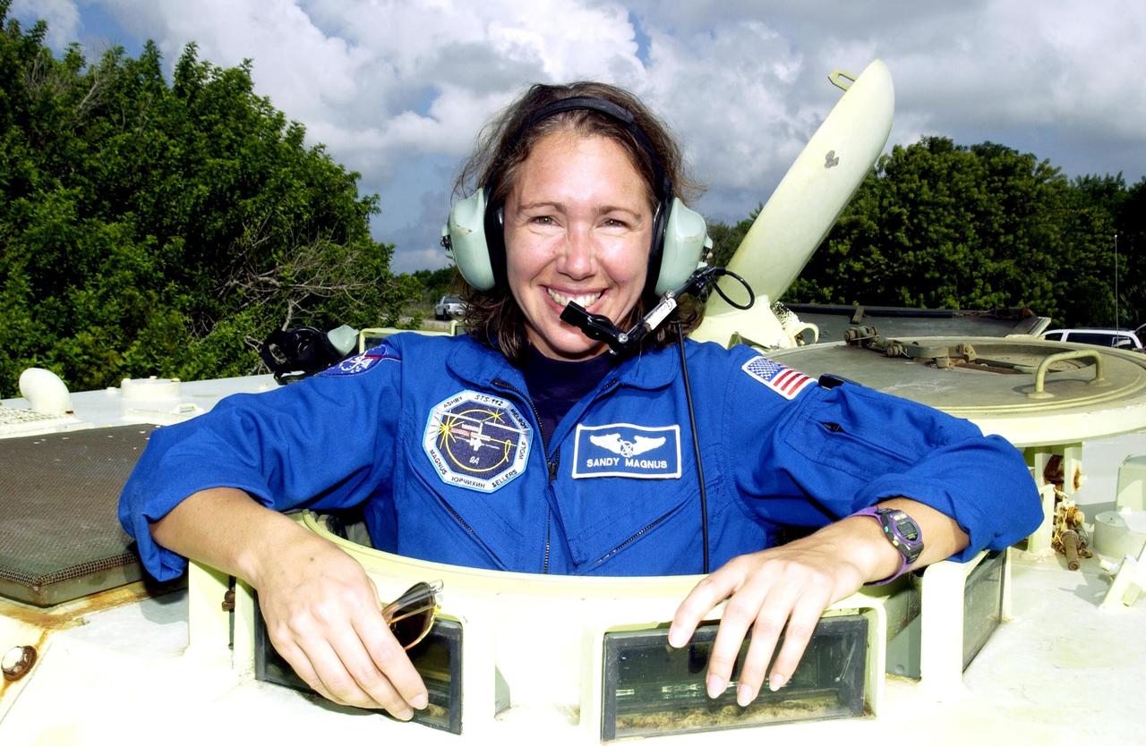 KENNEDY SPACE CENTER, Fla. -  STS-112 Mission Specialist Sandra Magnus is ready for her practice run driving the M-113 armored personnel carrier.  Magnus and the rest of the crew are at KSC for Terminal Countdown Demonstration Test activities, which also include a simulated launch countdown.  Mission STS-112 aboard Space Shuttle Atlantis is scheduled to launch no earlier than Oct. 2, between 2 and 6 p.m. EDT.  STS-112 is the 15th assembly mission to the International Space Station.  Atlantis will be carrying the S1 Integrated Truss Structure, the first starboard truss segment.  The S1 will be attached to the central truss segment, S0, during the 11-day mission.