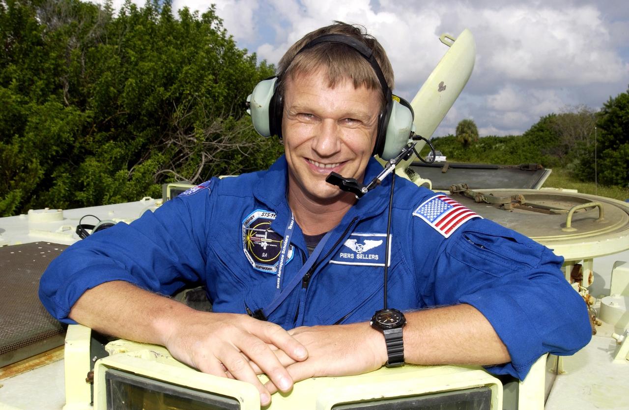 KENNEDY SPACE CENTER, Fla. - STS-112 Mission Specialist Piers Sellers is ready for his practice run driving the M-113 armored personnel carrier.  Sellers and the rest of the crew are at KSC for Terminal Countdown Demonstration Test activities, which also include a simulated launch countdown.  Mission STS-112 aboard Space Shuttle Atlantis is scheduled to launch no earlier than Oct. 2, between 2 and 6 p.m. EDT.  STS-112 is the 15th assembly mission to the International Space Station.  Atlantis will be carrying the S1 Integrated Truss Structure, the first starboard truss segment.  The S1 will be attached to the central truss segment, S0, during the 11-day mission.