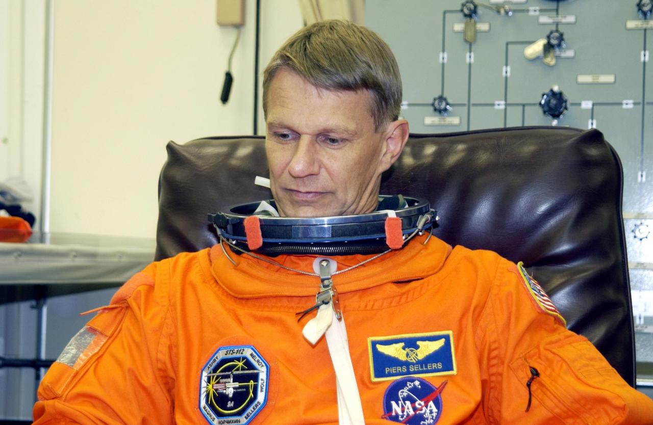 KENNEDY SPACE CENTER, Fla. - STS-112 Mission Specialist Piers Sellers undergoes suit check, part of Terminal Countdown Demonstration Test activities.   The TCDT also includes emergency egress training and a simulated launch countdown.  The mission aboard Space Shuttle Atlantis  is scheduled to launch no earlier than Oct. 2, between 2 and 6 p.m. EDT.  STS-112 is the 15th assembly mission to the International Space Station.  Atlantis will be carrying the S1 Integrated Truss Structure, the first starboard truss segment.  The S1 will be attached to the central truss segment, S0, during the 11-day mission.  Sellers will be undertaking three spacewalks during the mission.  In addition, he will be in charge of on-board computers and rendezvous tools during Atlantis' approach for docking and the undocking and flyaround.  STS-112 is Sellers first Shuttle flight.